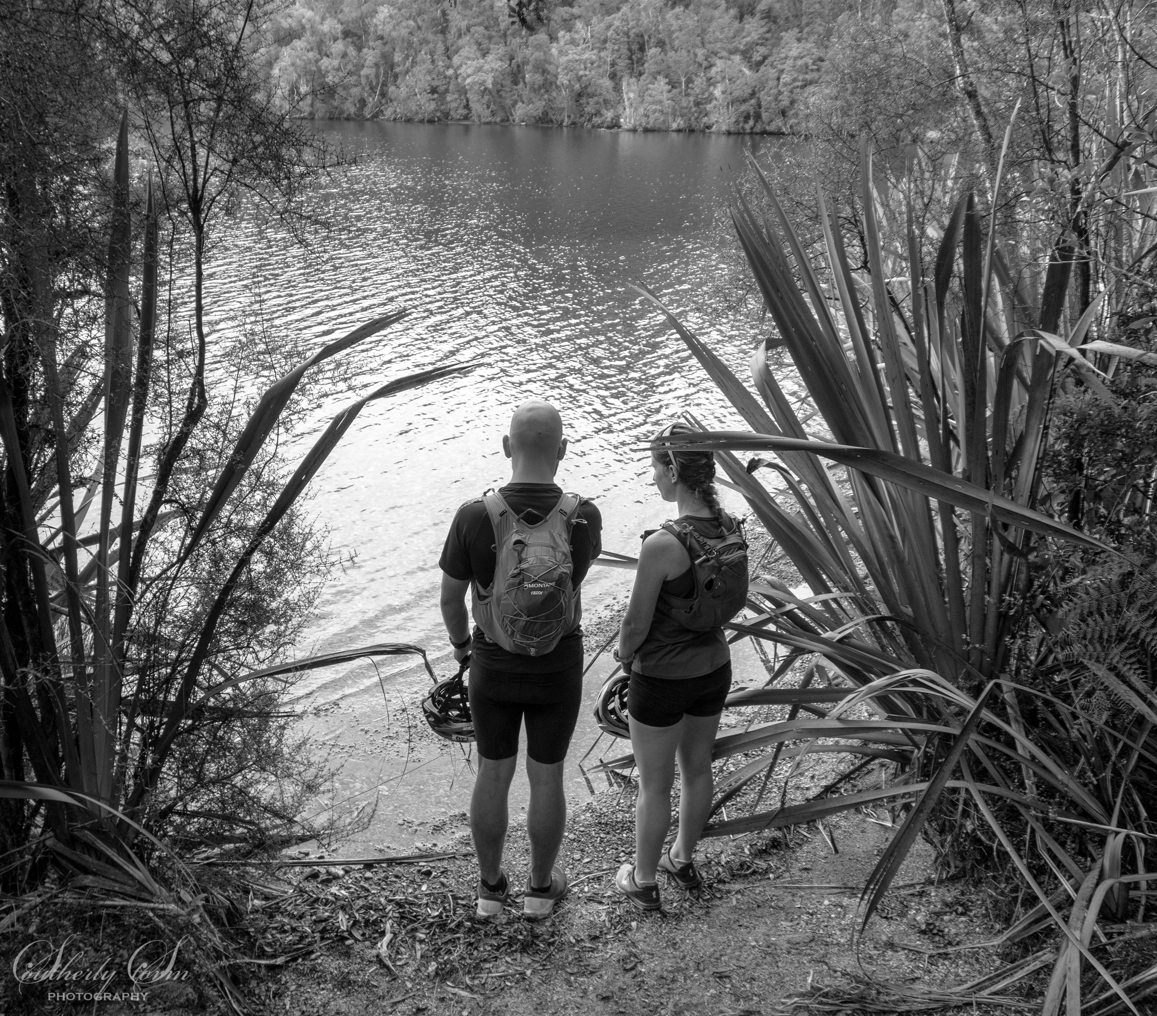 Black and white photo of a couple at Lake Kaniere