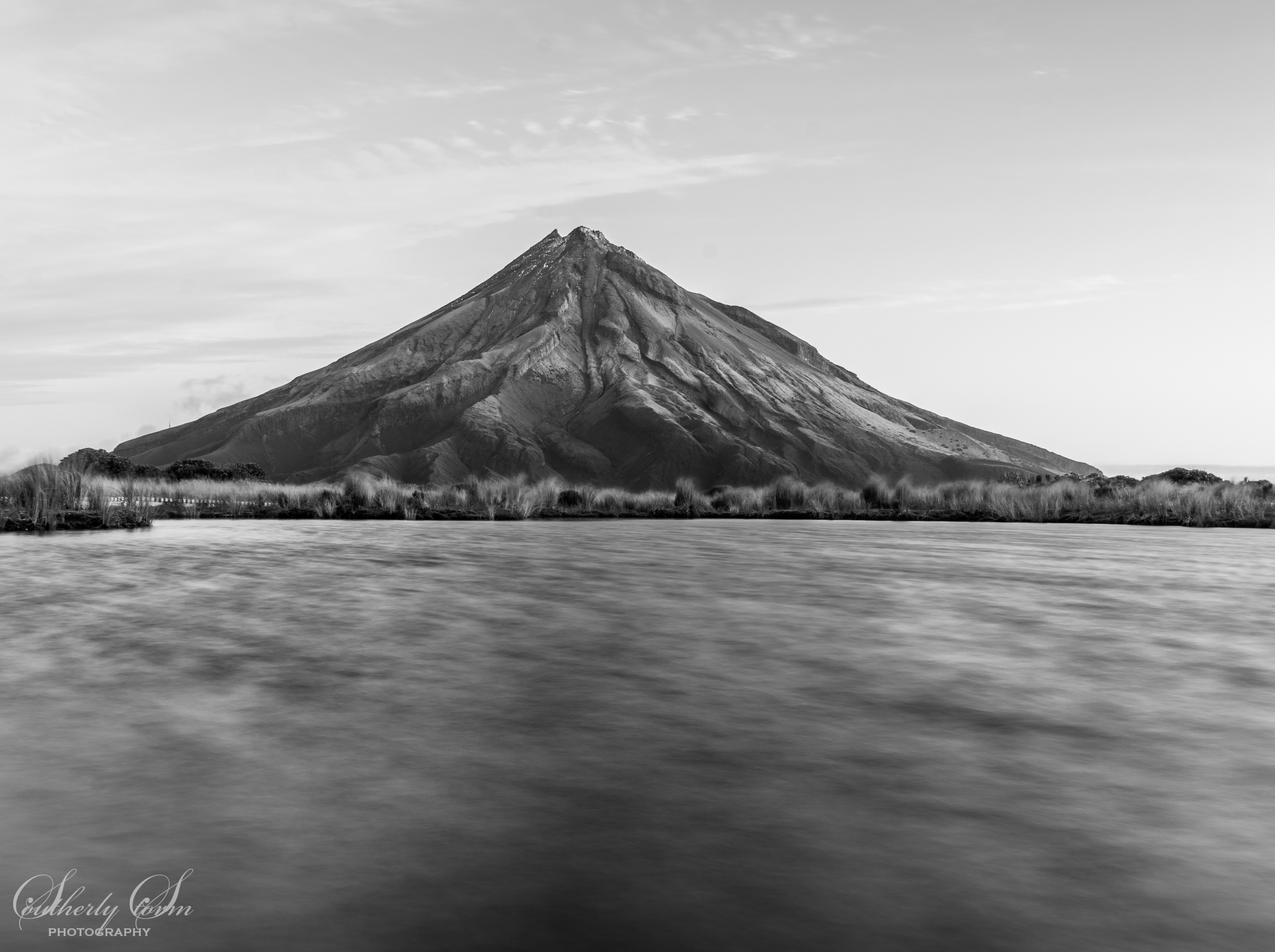 Black and white of Mt Taranaki from Pouakai Tarn