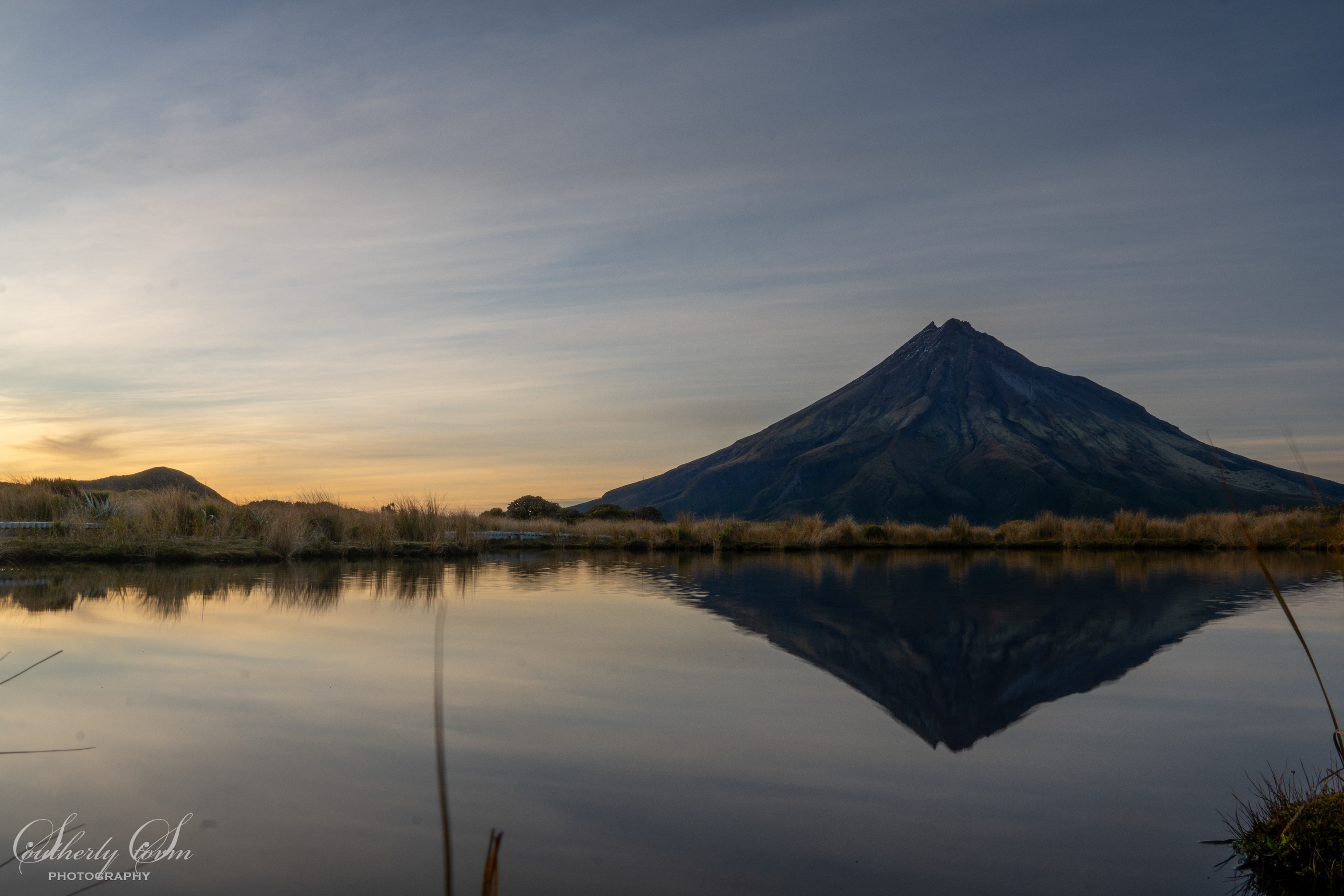 Mt Taranaki reflected in Pouakai Tarn at dawn