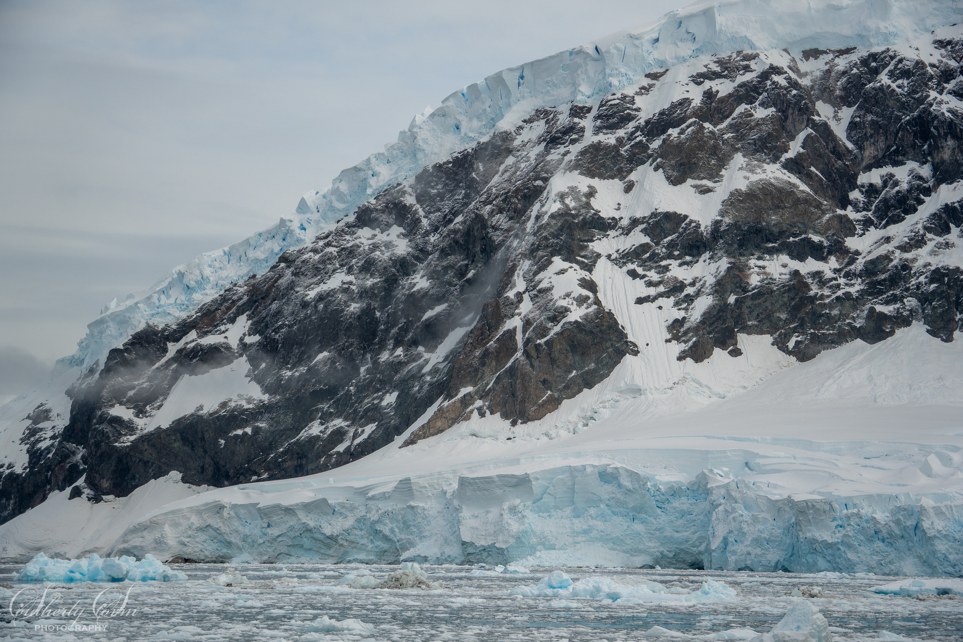 Ice cliffs on rock cliffs
