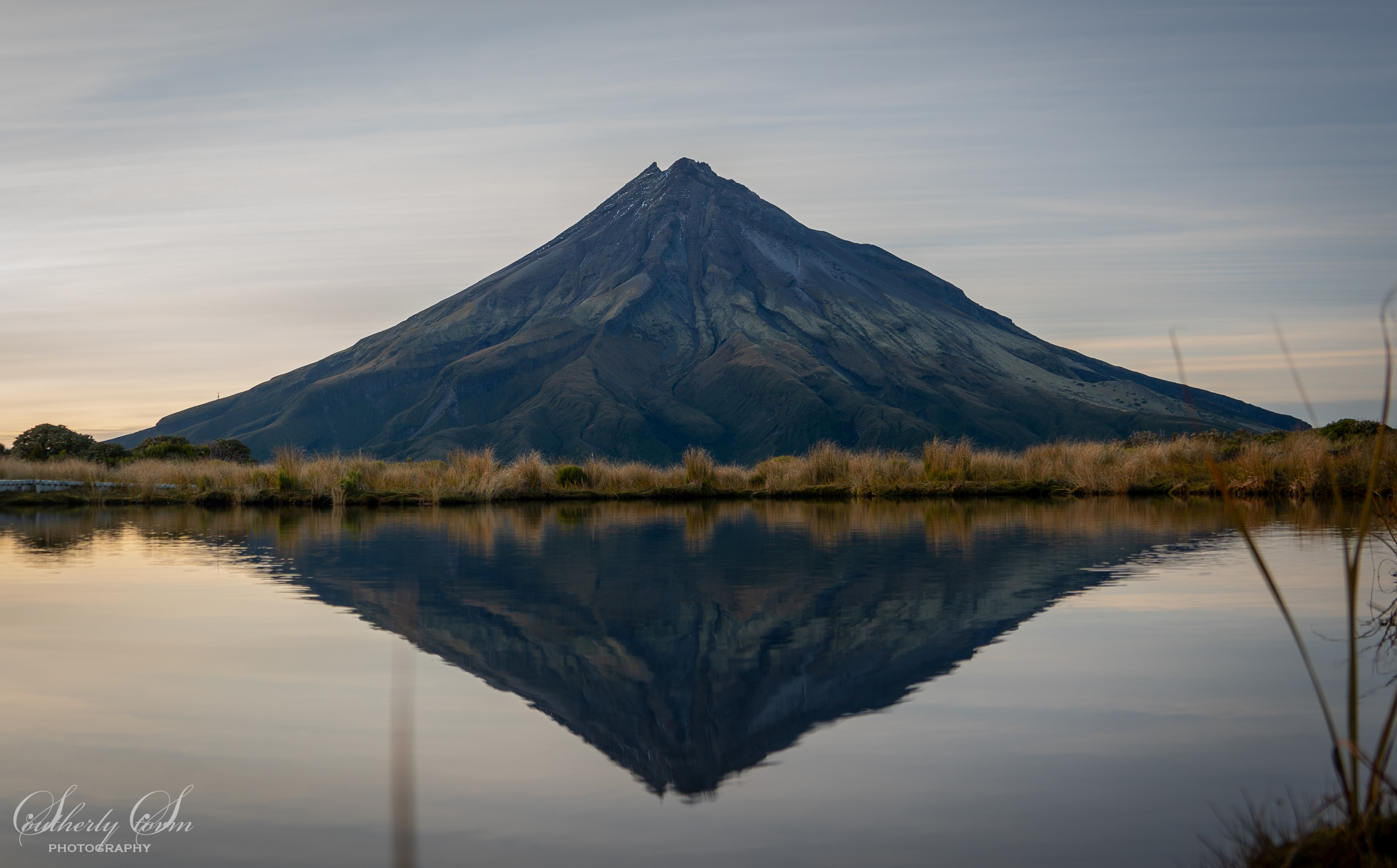 Mt Taranaki reflected in Pouakai Tarn at dawn
