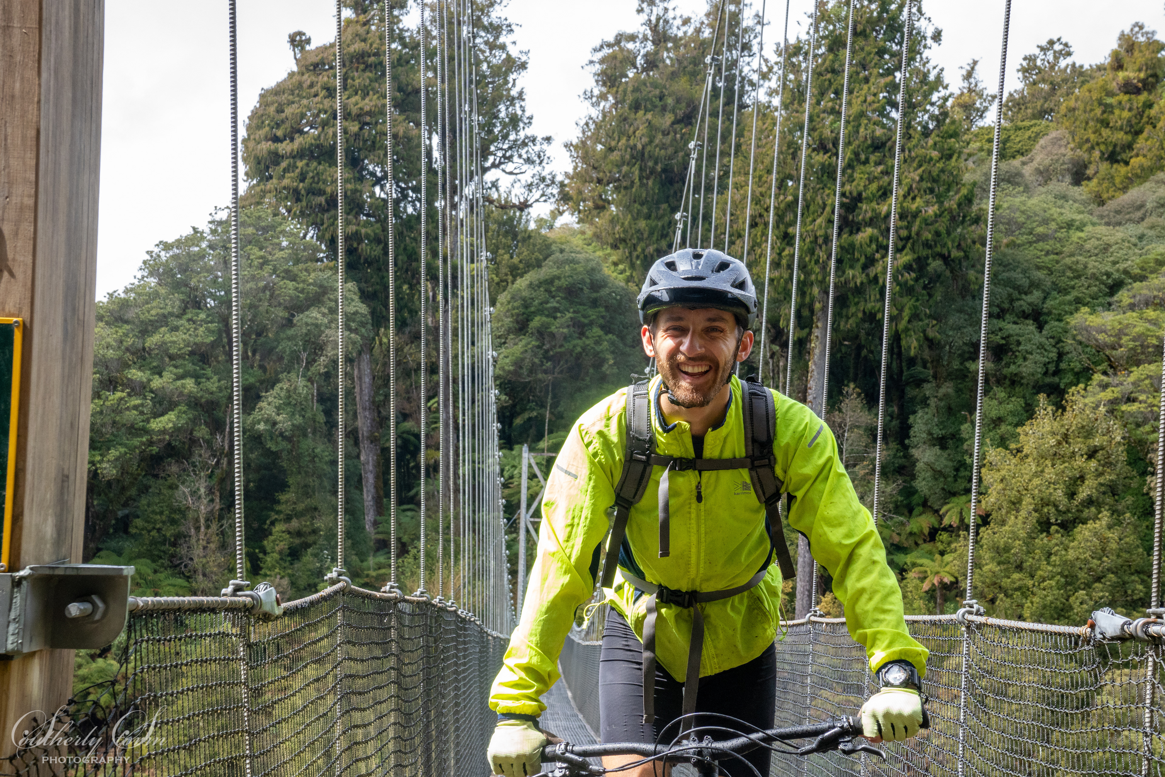 Biking across a swing bridge