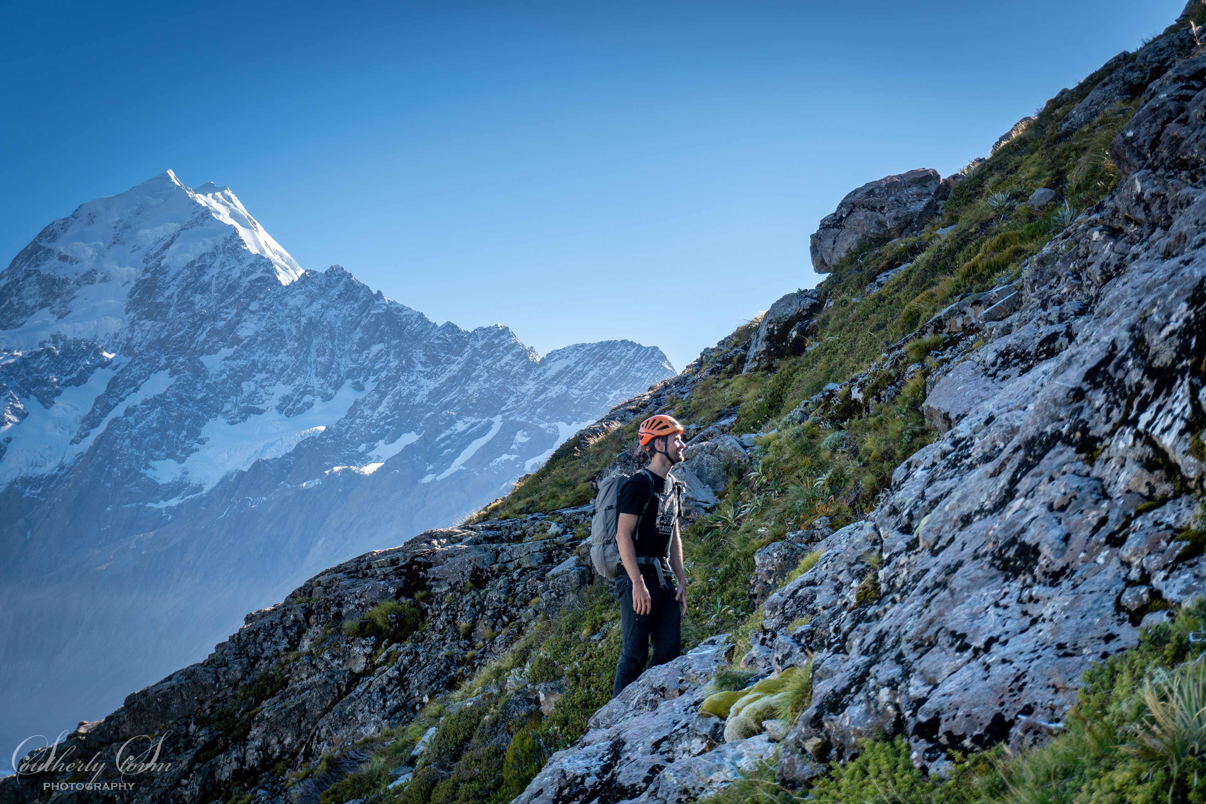 A climber on guideless butress with Aoraki Mt Cook in the background