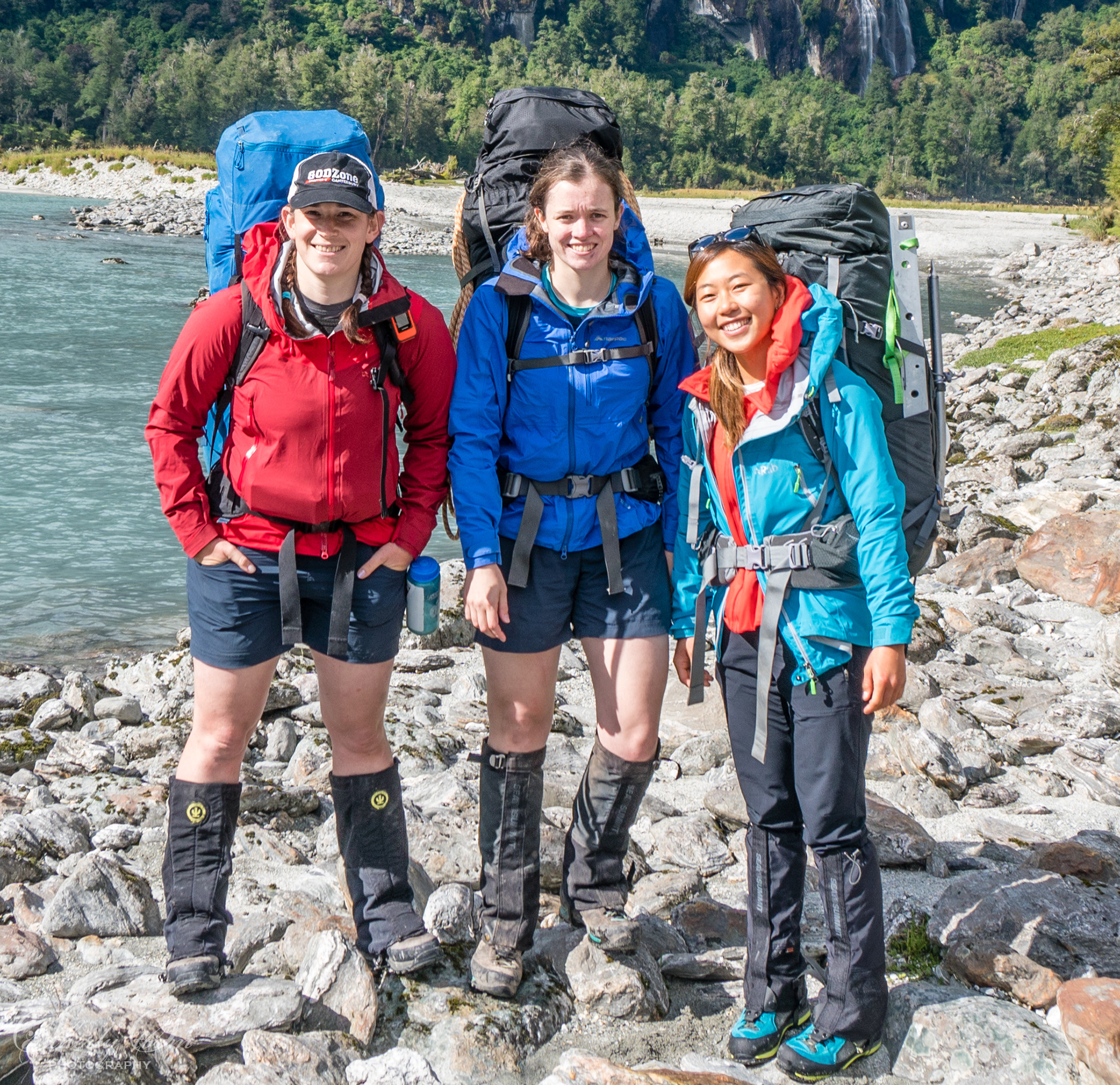 Three women trampers setting out up the Arawhata River