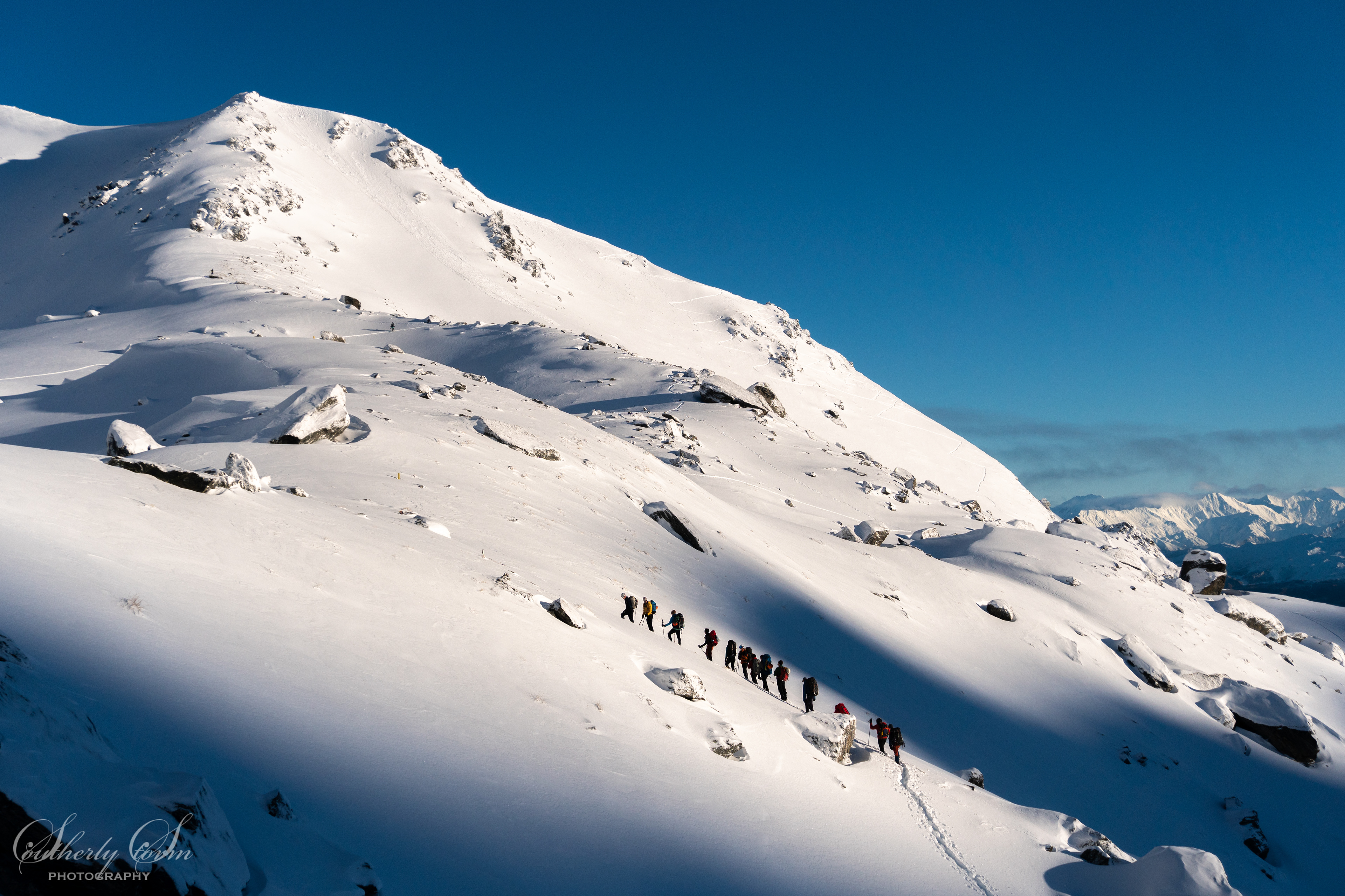 Climbers heading up to Single Cone in The Remarkables