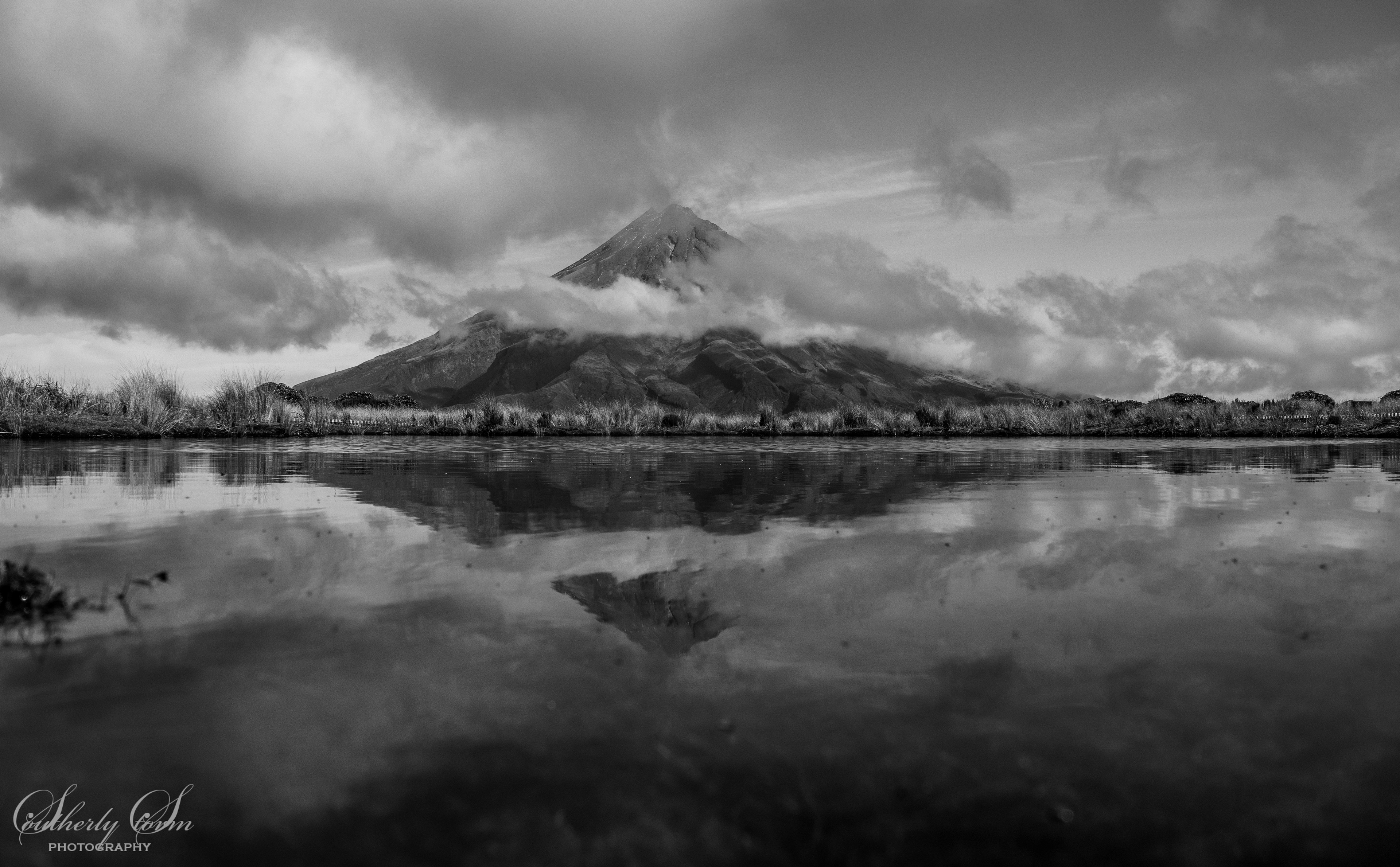 Mt Taranaki reflected in Pouakai Tarn in Black and White