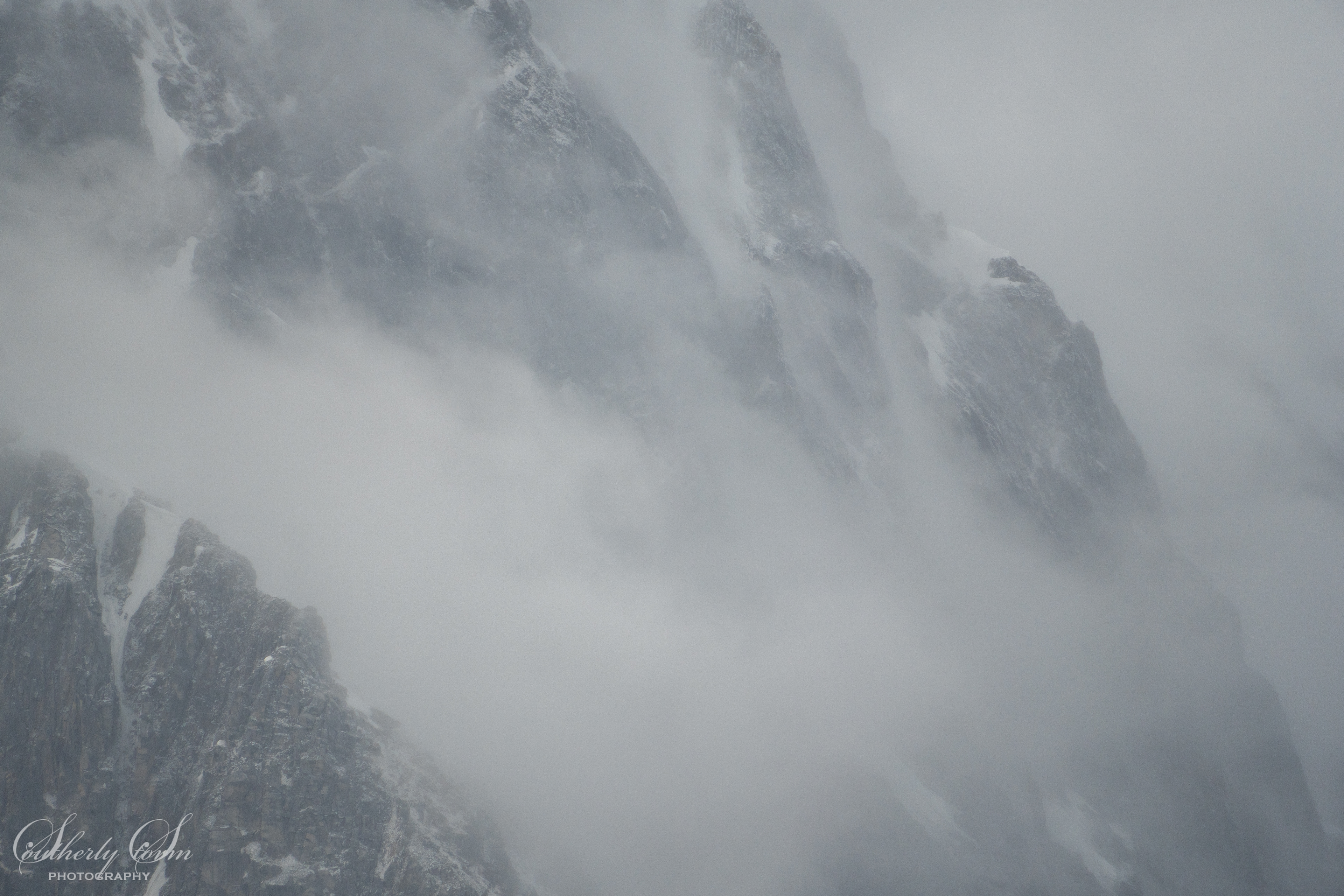 Rocky mountainsides and clouds