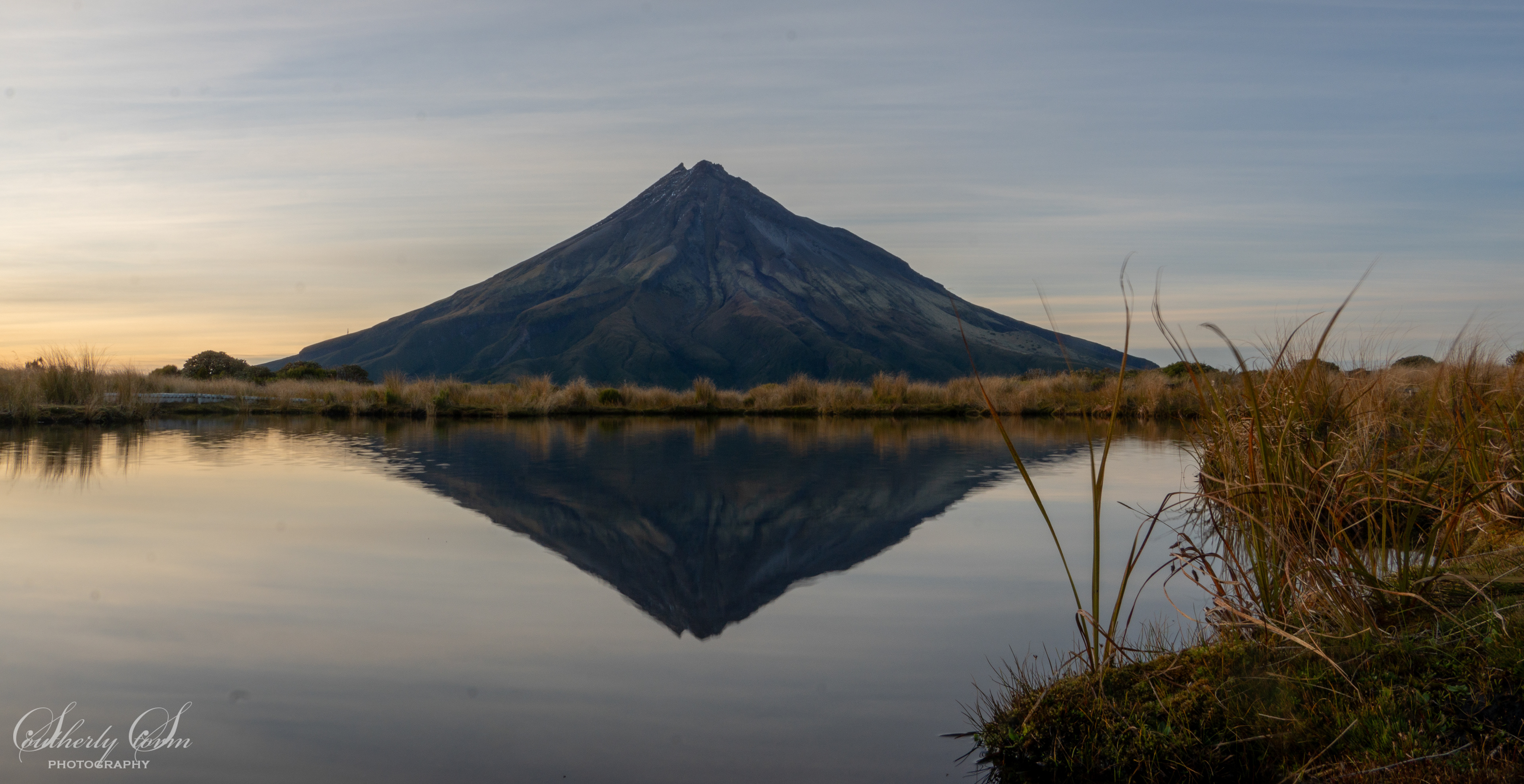 Mt Taranaki reflected in Pouakai Tarn at dawn