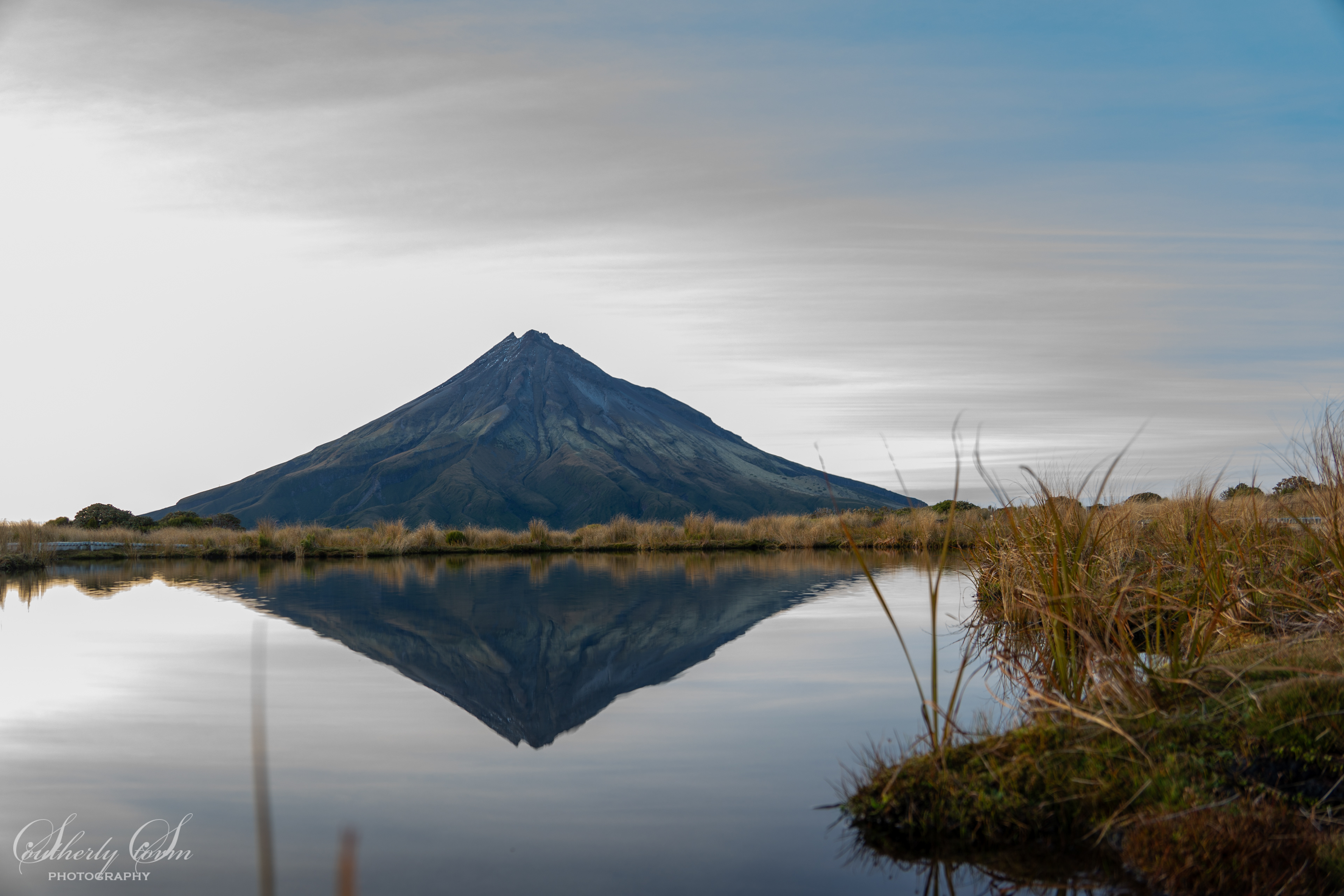 Mt Taranaki reflected in Pouakai Tarn at dawn