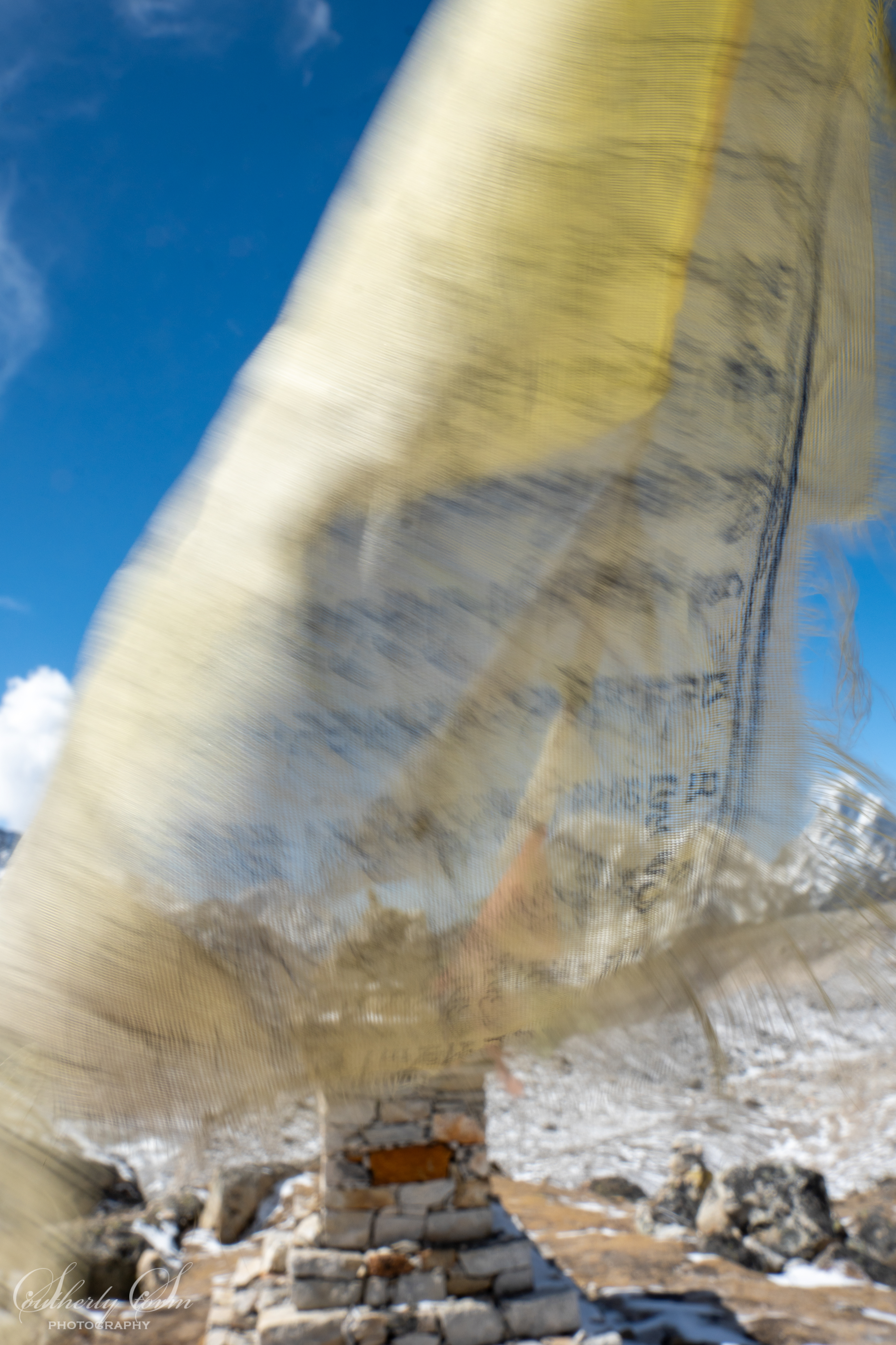Prayer flags and shrines to fallen climbers