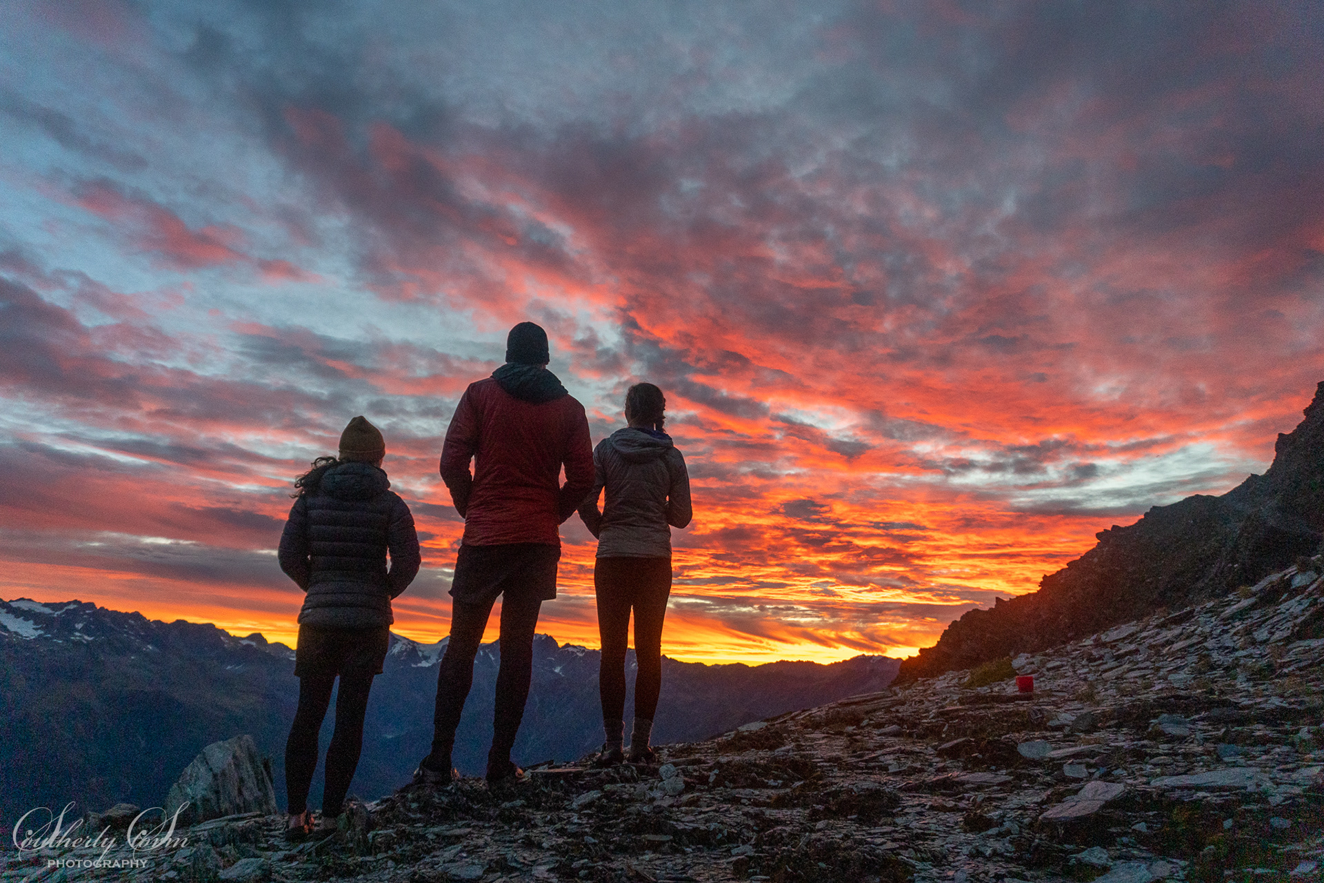 Three admiring the sunset