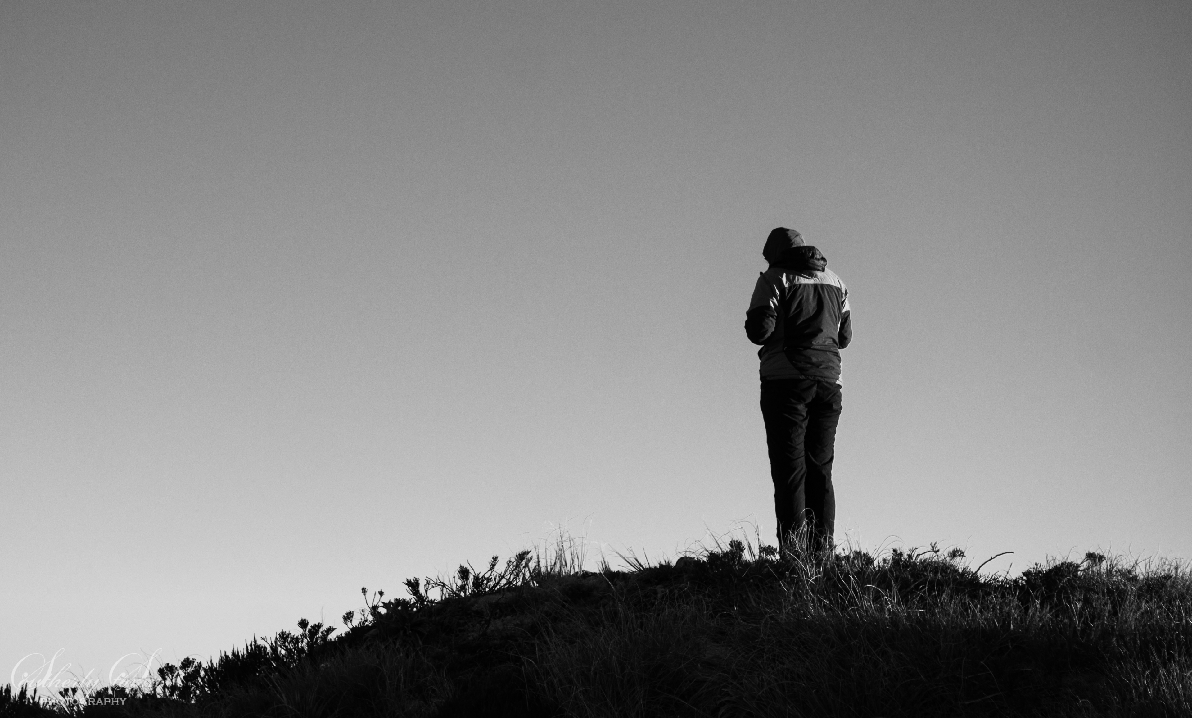 Black and white photo - girl on a ridgeline