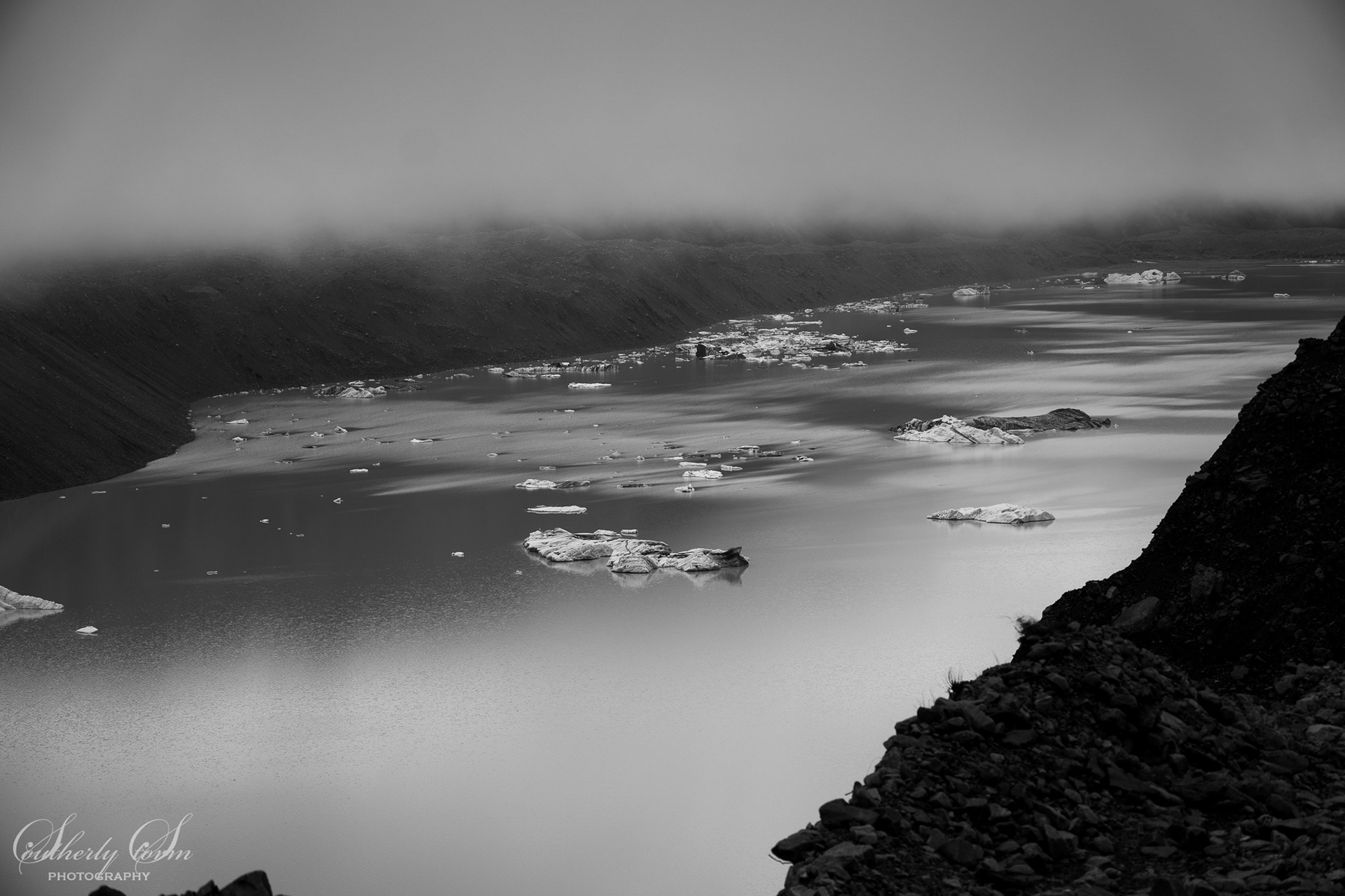 Black and White Tasman Glacier lake with icebergs