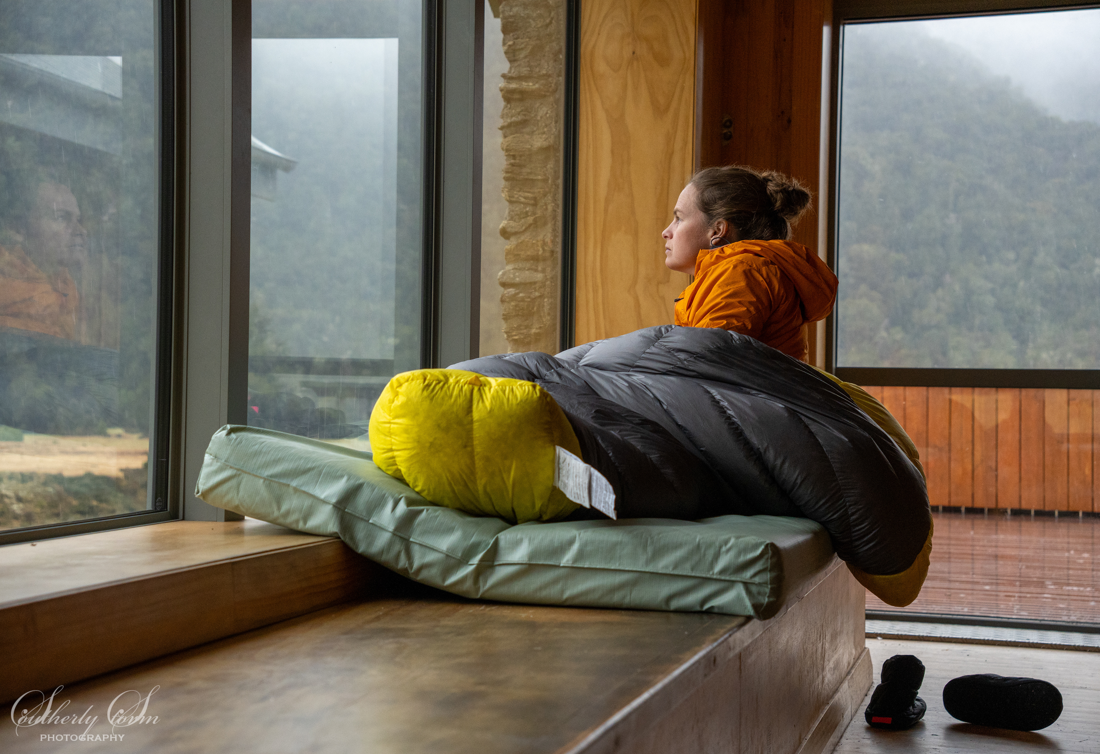 Liv enjoying cosy hut vibes from her sleeping bag