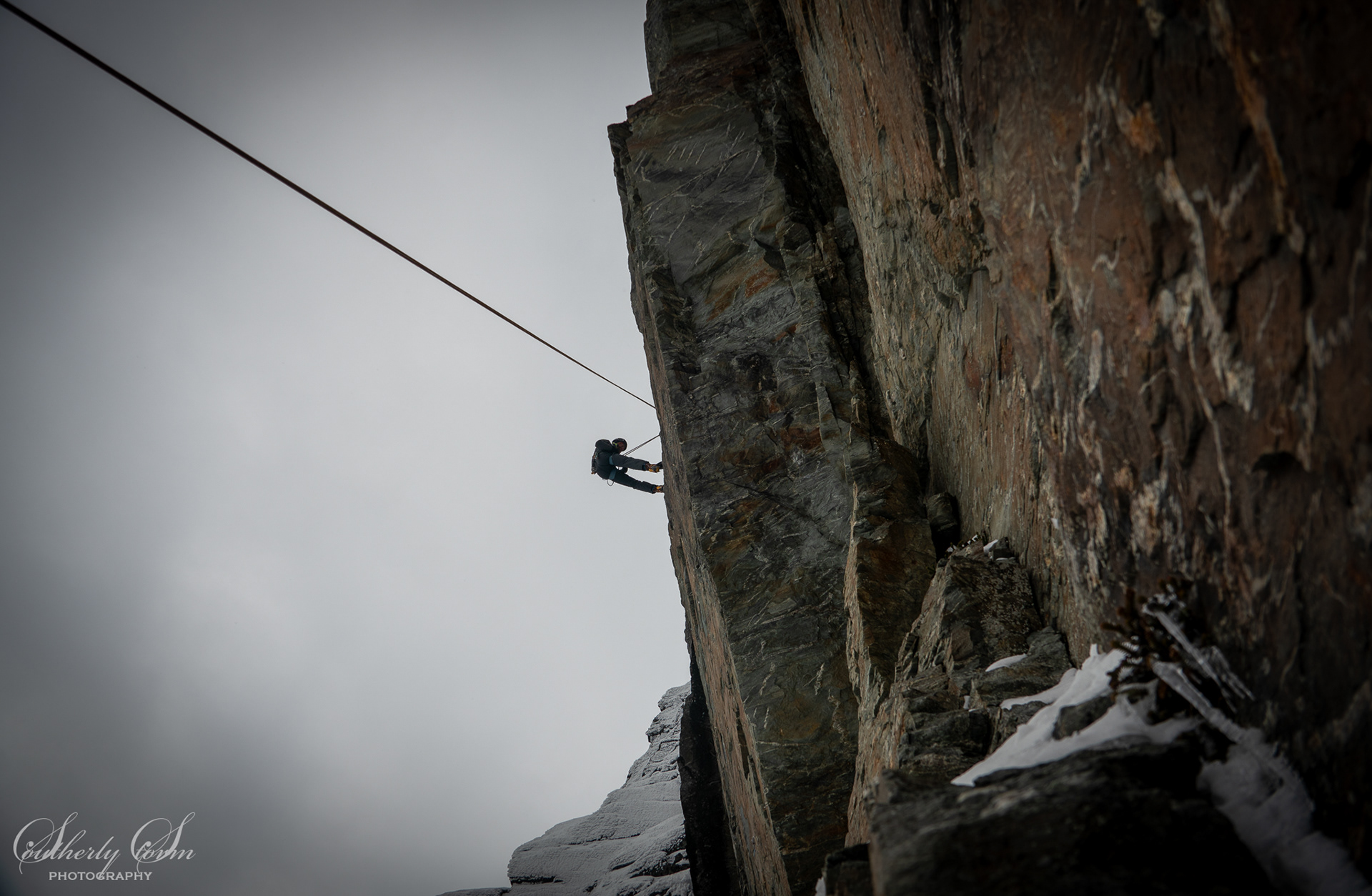 Abseiling off a climb in the moutnains