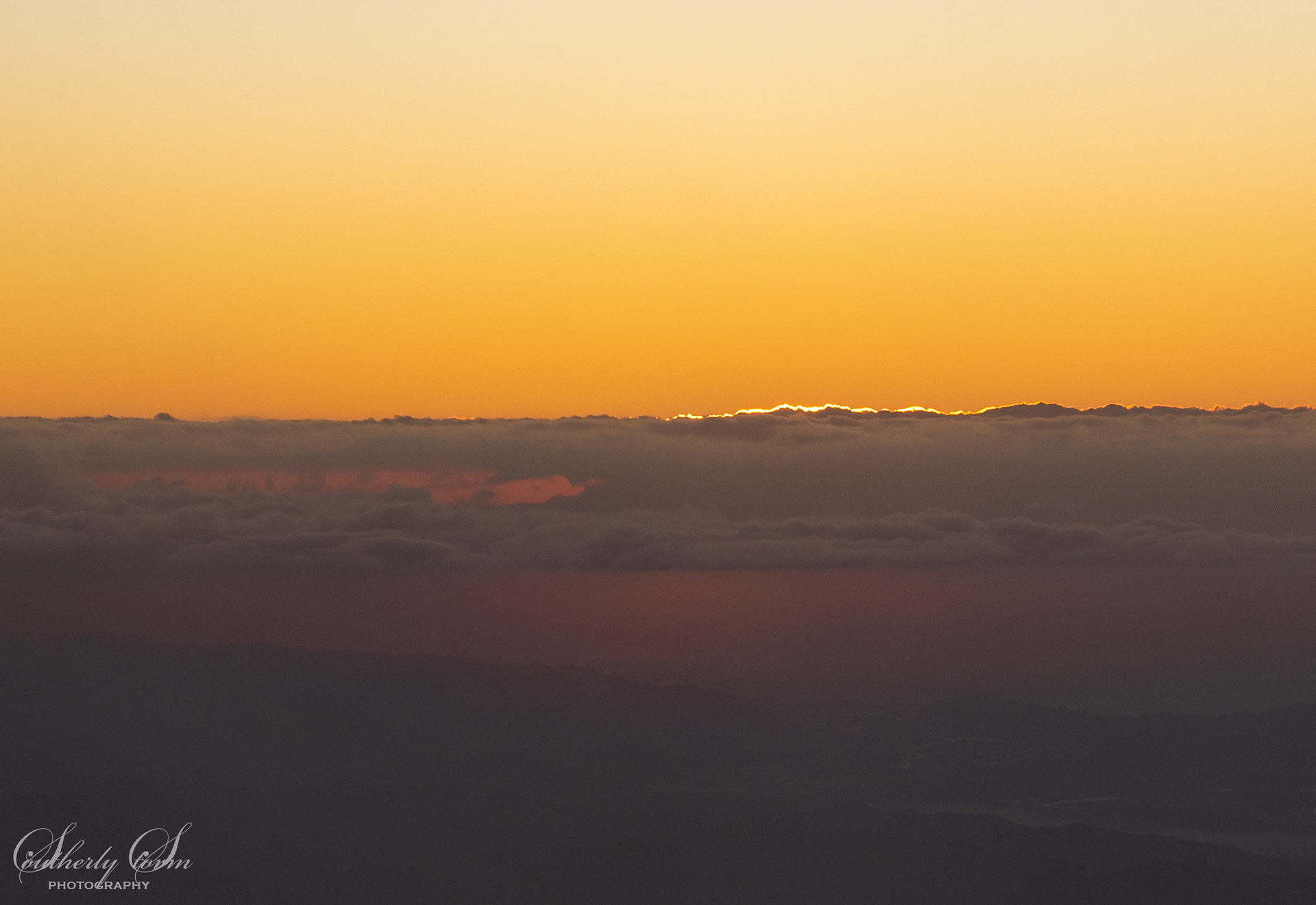 Edge of sunrise behind the clouds