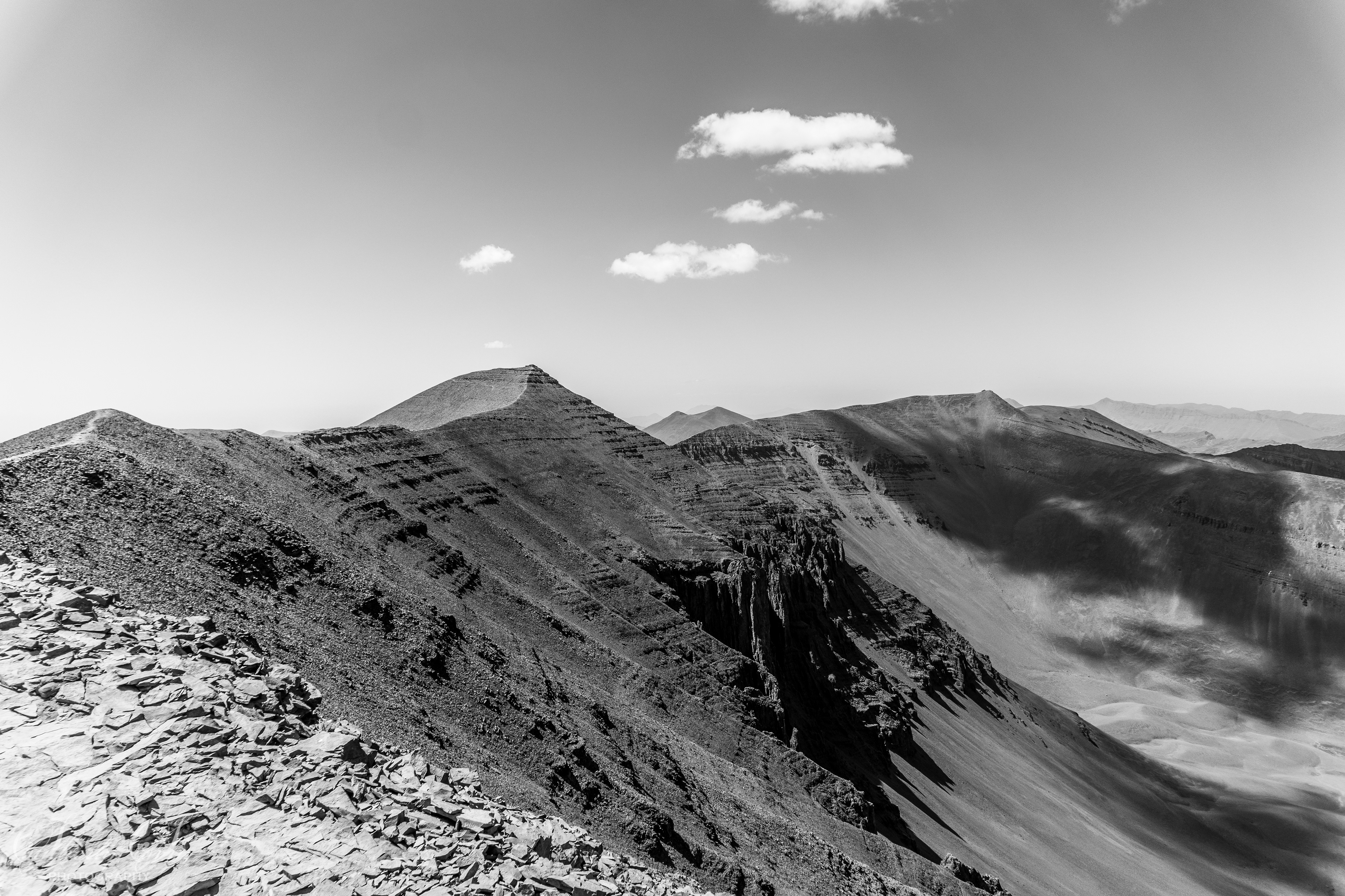 Black and white strata along a mountain range