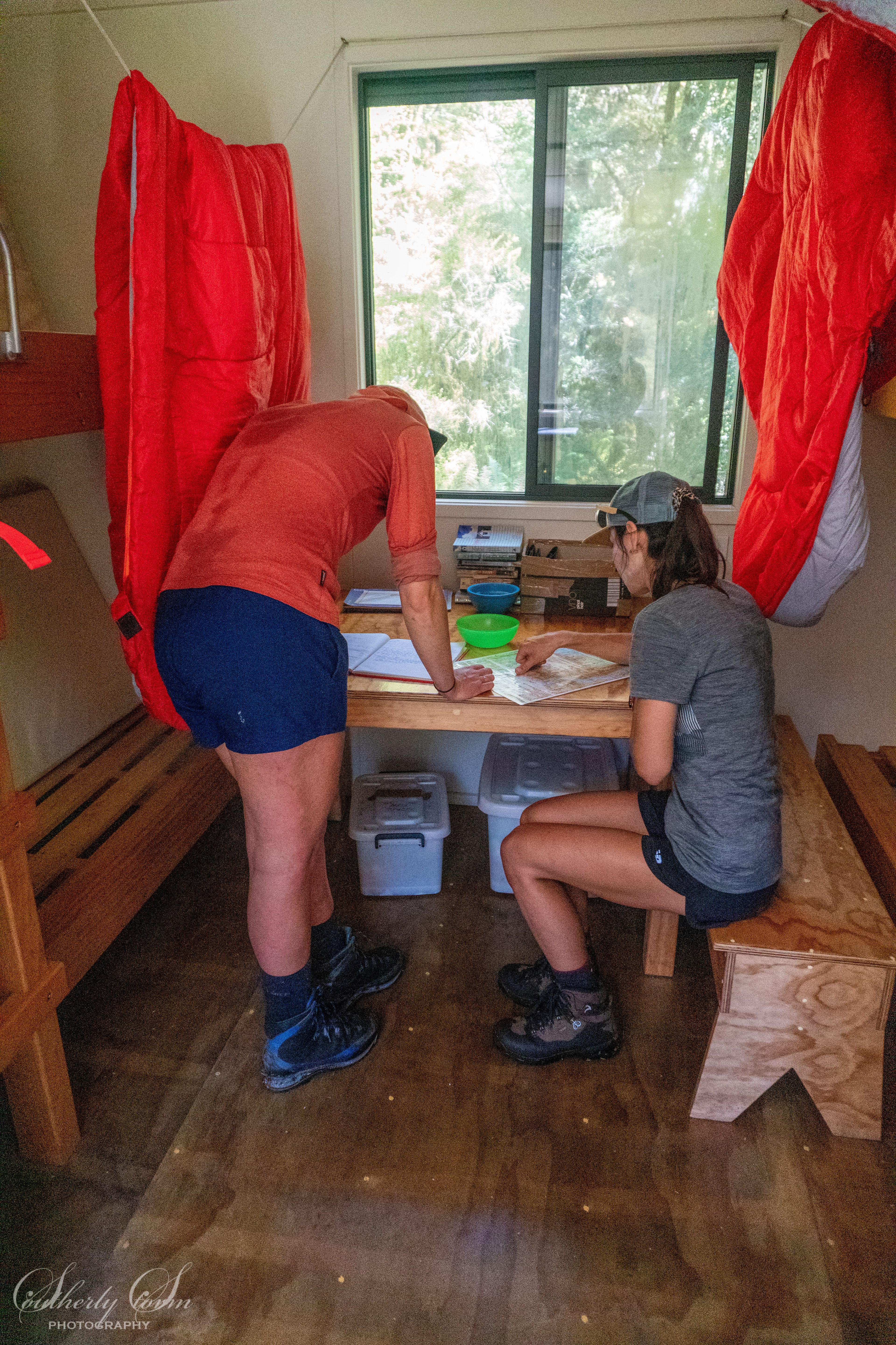 Two trampers in a hut