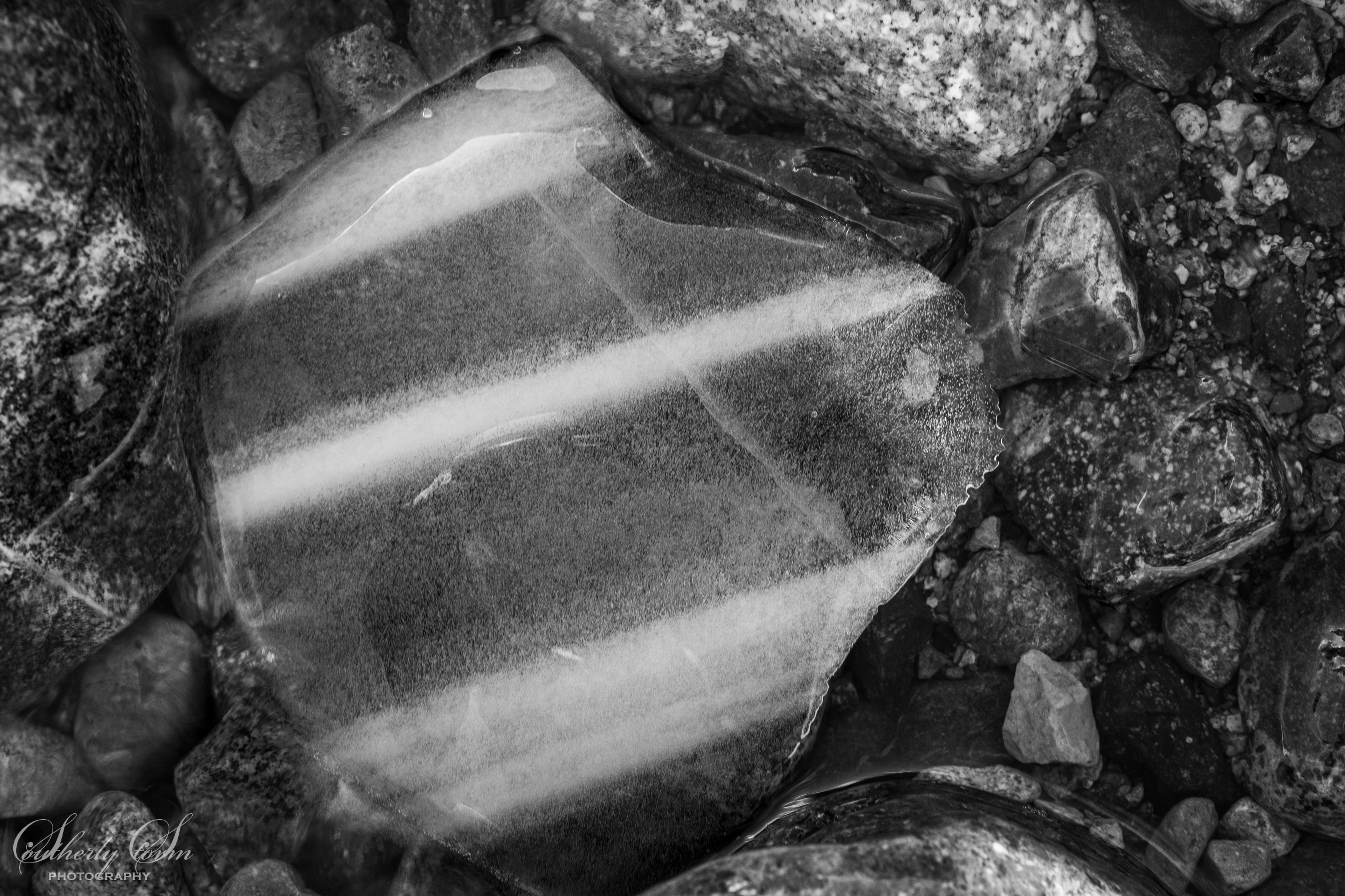 Black and white layers in ice