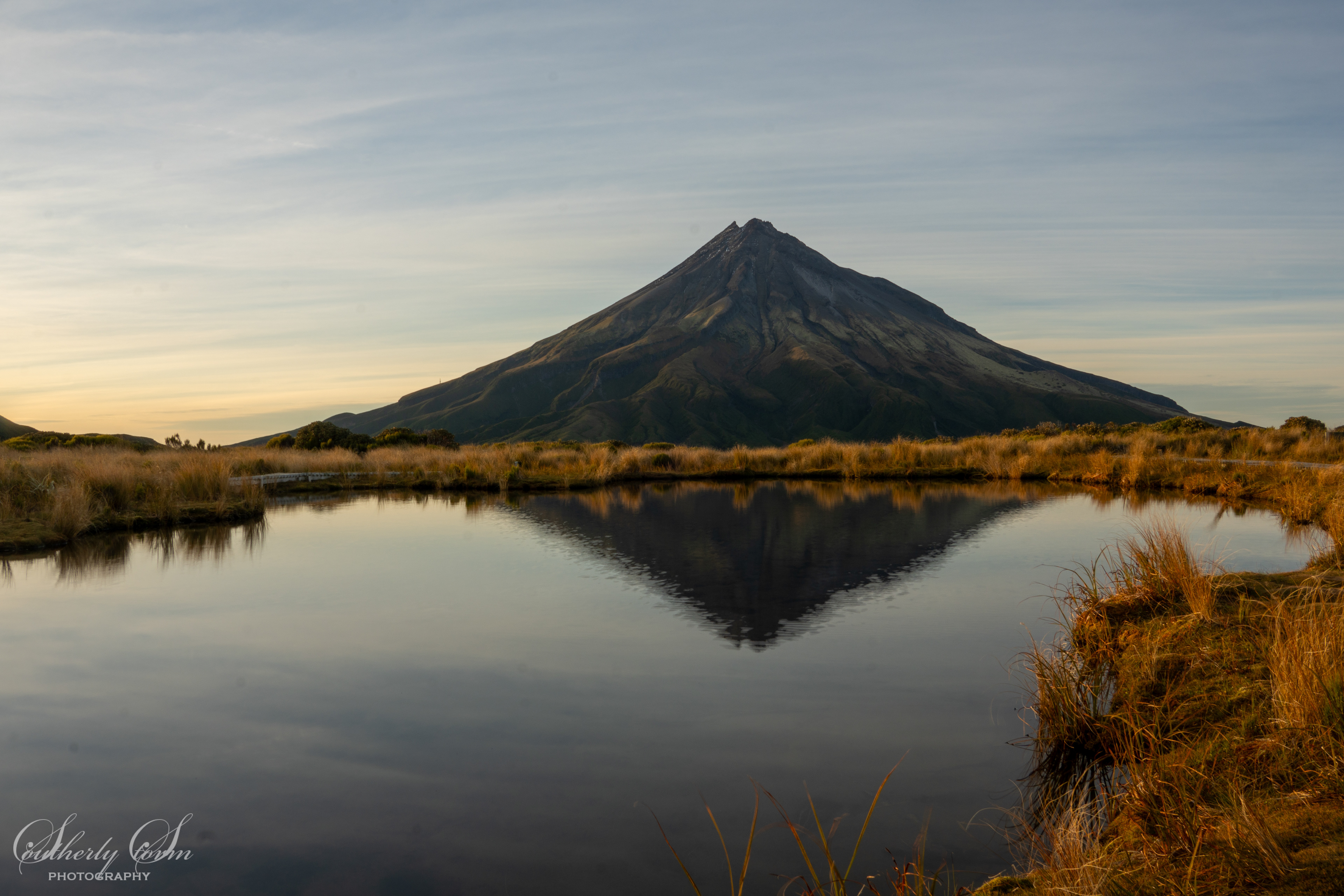 Mt Taranaki reflected in Pouakai Tarn at dawn