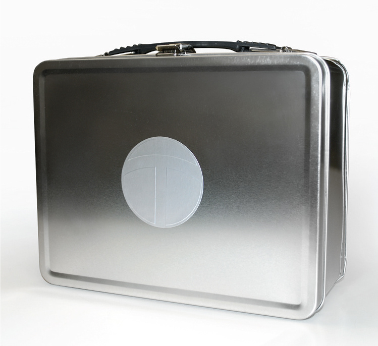 Silver lunchbox packaging with silver metallic embossed sticker.