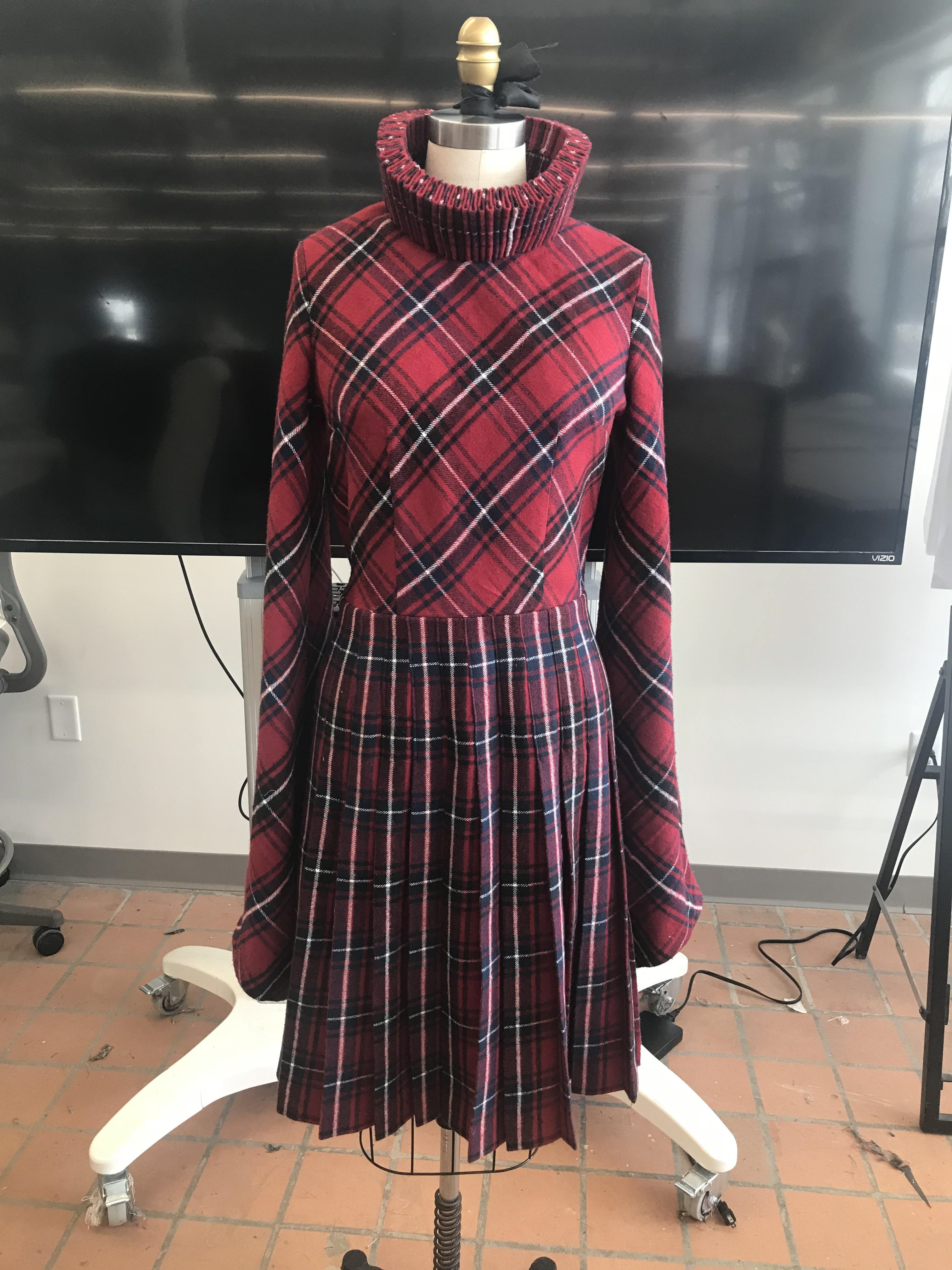 Project 3 of draping class, a knee length dress with a cartridge pleated collar and hand pleated skirt.  The goal was to transform a print or pattern into a completely new one.