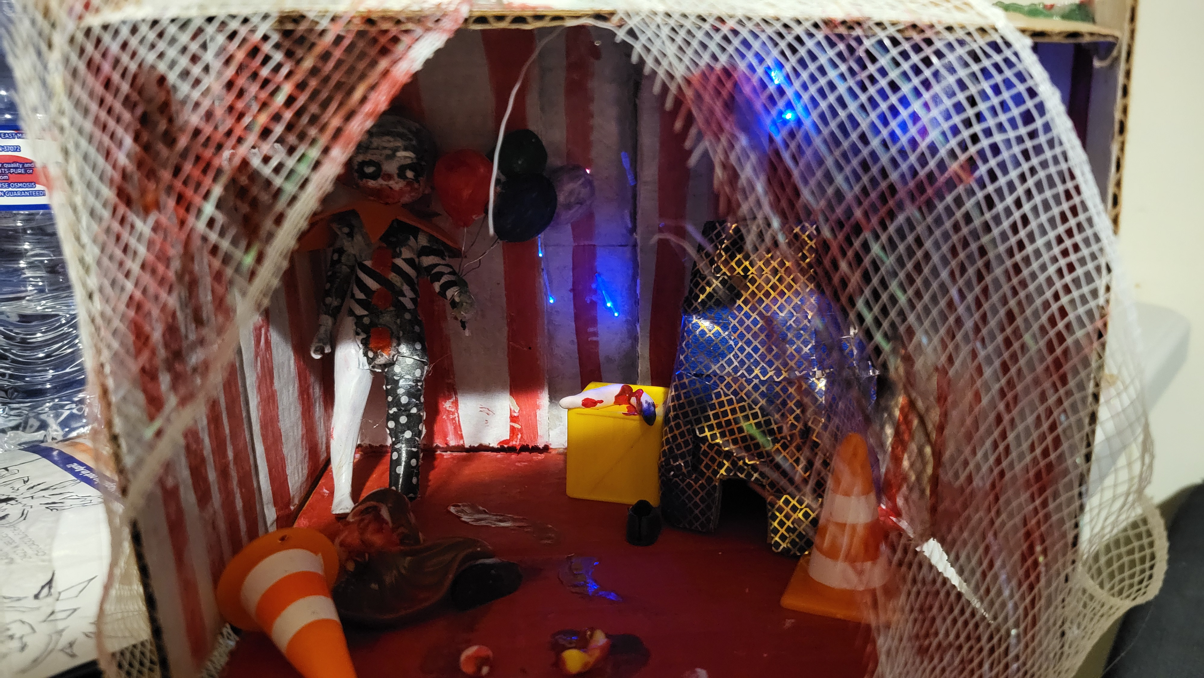 Jennifer Rojas I used cardboard, gut glue, paint , and random toys, a doll. To create this pisces I decided to create this pisces because back than it was a serial killer named John wayne. He was famous for killing mostly kids