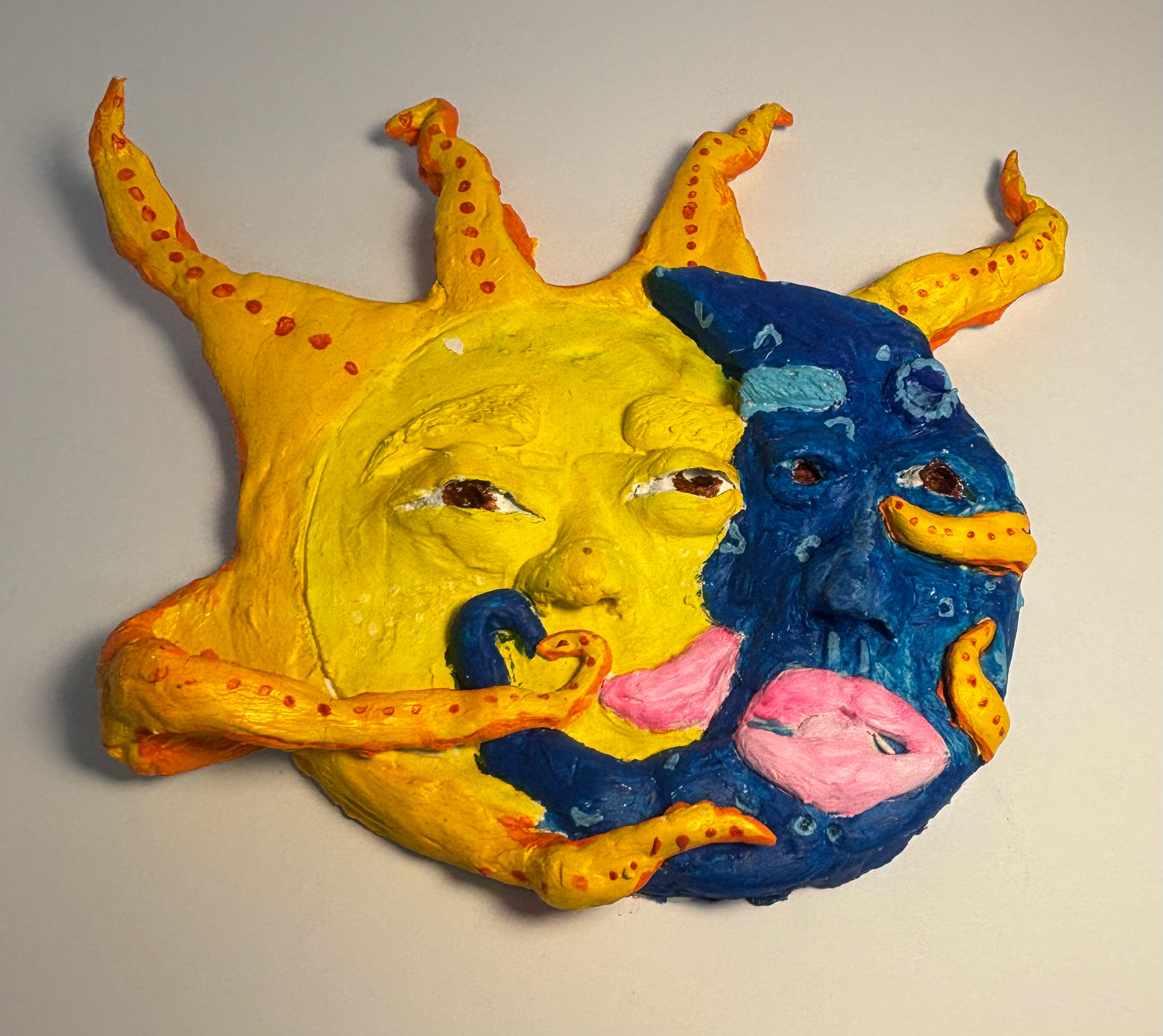 Jennifer Quinde I made the sun and the moon together with air-dry clay I put texture on it I painted to make it look more detailed,with their faces and adding color on each piece .