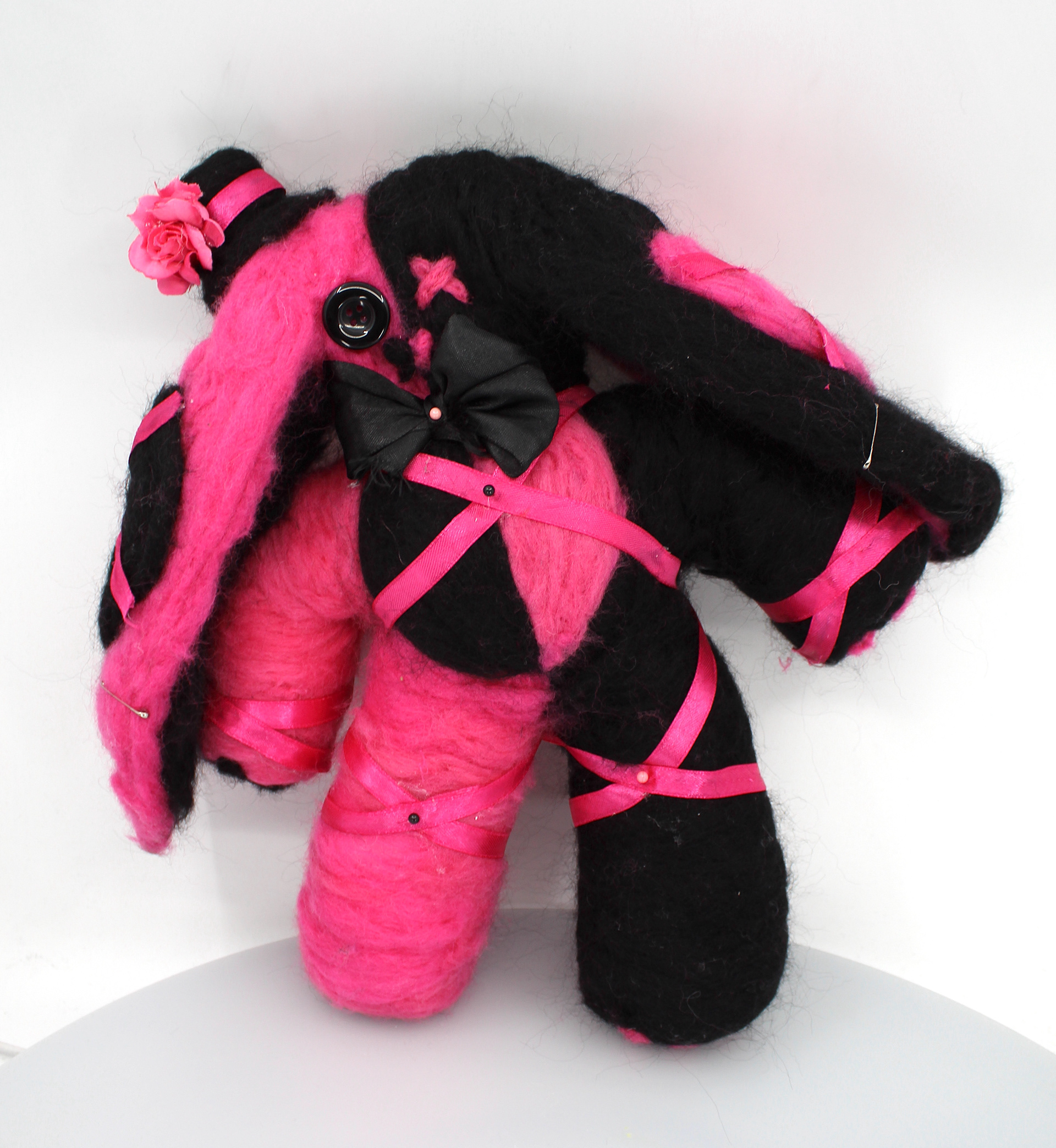 Jocelyn Olguin Ruby is made from wool that has been built by the circus master for its queen. It says that he made a face small on purpose, maybe he saw something or a prediction? The circus master gave Ruby to the queen, but then the king was jealous of her getting attention, but he had many mistresses. Soon the king's jealousy consumed him to the point that he started abusing his wife and mistresses the queen after many years had enough and tried to run away and leave him, but the king wanted her to stay. His vision turned red, he grabbed the near thing, and hit the queenside of the head. The red vision faded away, and the king dropped the heavy metal as saw the scene the sides of the queen's head were squished like a flat sword bleeding on the ground no longer breathing and that was the end for her. Nobody knew what fully happened to the queen after. It said that the circus master disappeared. The only thing left of the queen was the pink string wrapped in the bunny and her heart no longer beating.