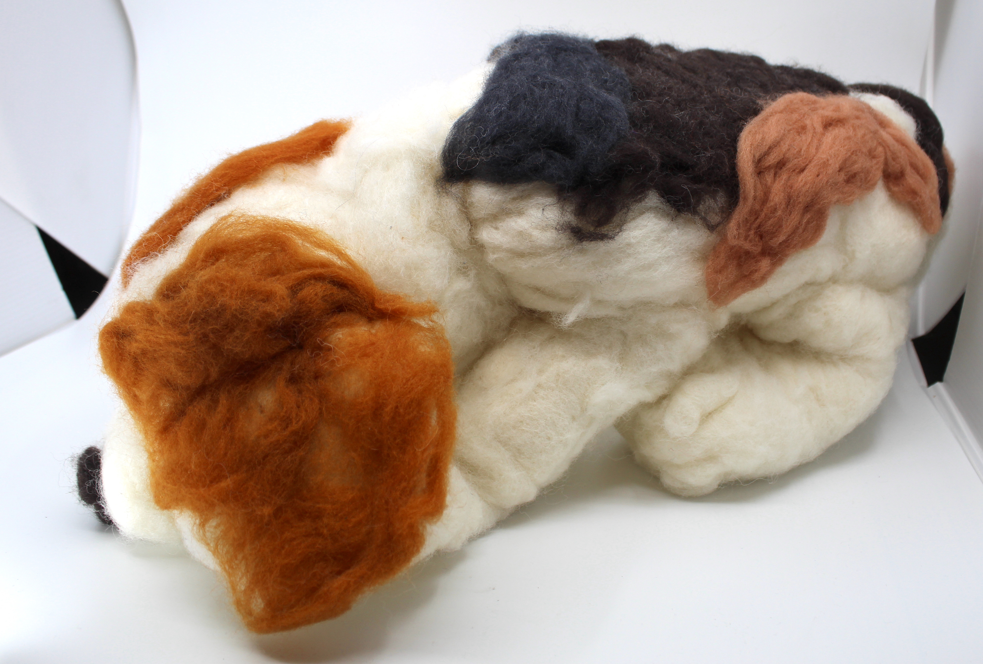 Dhiren Rampersaud This project is a needle felted sculpture. To make this artw,ork I had to poke the felt many times to make it stick together to make something 3D. The sculpture is supposed to resemble a beagle dog breed. My inspiration to make this project is my brother. My brother's favorite dog breed is a beagle, so this artwork is a homage to my brother.