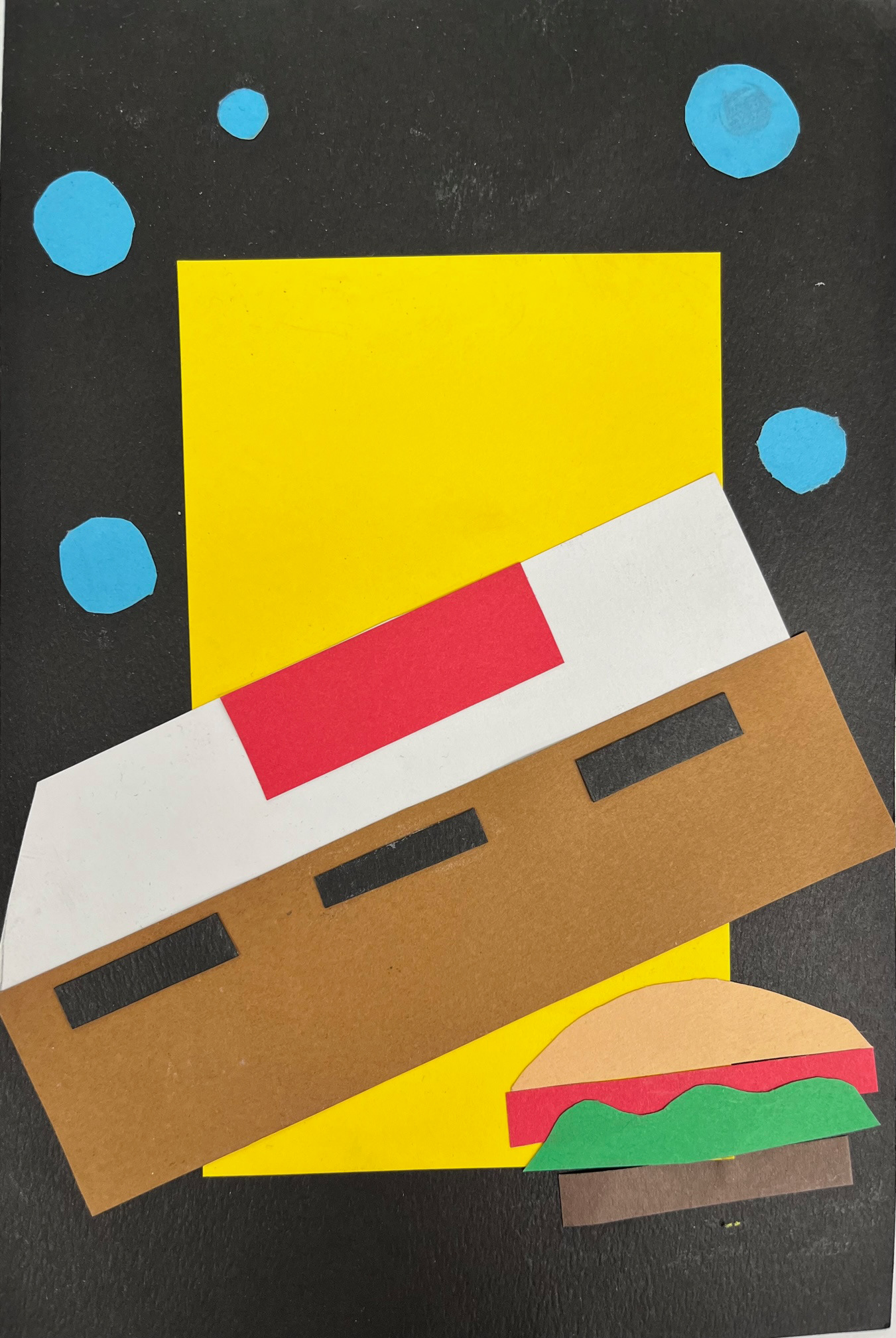 Makayla Seals - paper collage using shape to suggest a character (Spongebob).