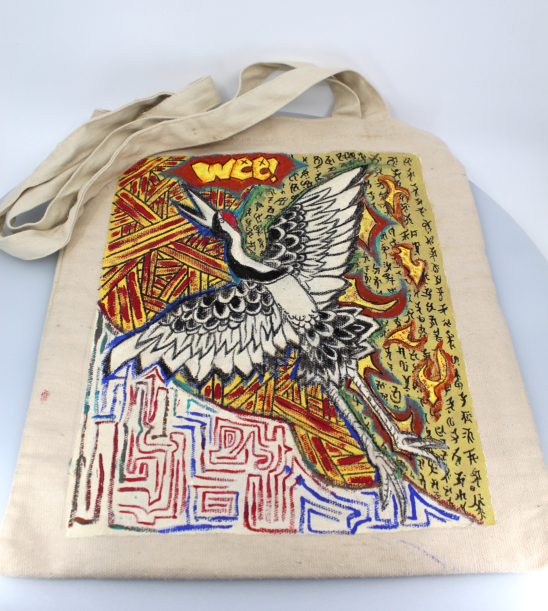 Josue Ramirez-Chilel - "Tote Bag"  This custom piece was done last minute with fabric paint on a canvas tote as my medium. None of it turned out how I originally planned. It looked messed up, and I ended up improvising the rest. The text doesn't actually say anything, it just looks cool. I like the way it turned out in the end. It looks a lot better than it was originally going to.