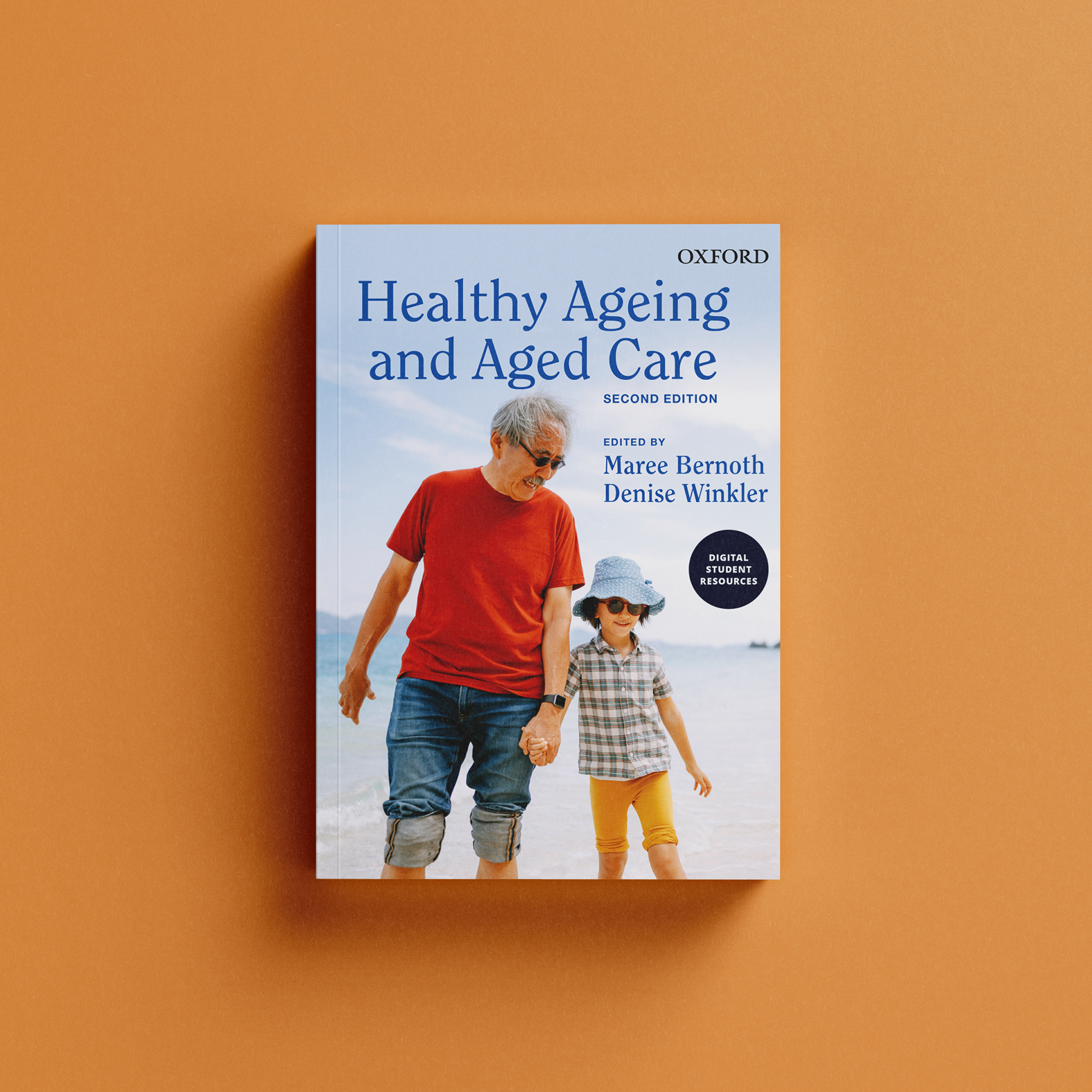 Book cover image showing a healthy Japanese grandfather in t-shirt and jeans walking hand in hand with his six year old granddaughter. They are on the beach.