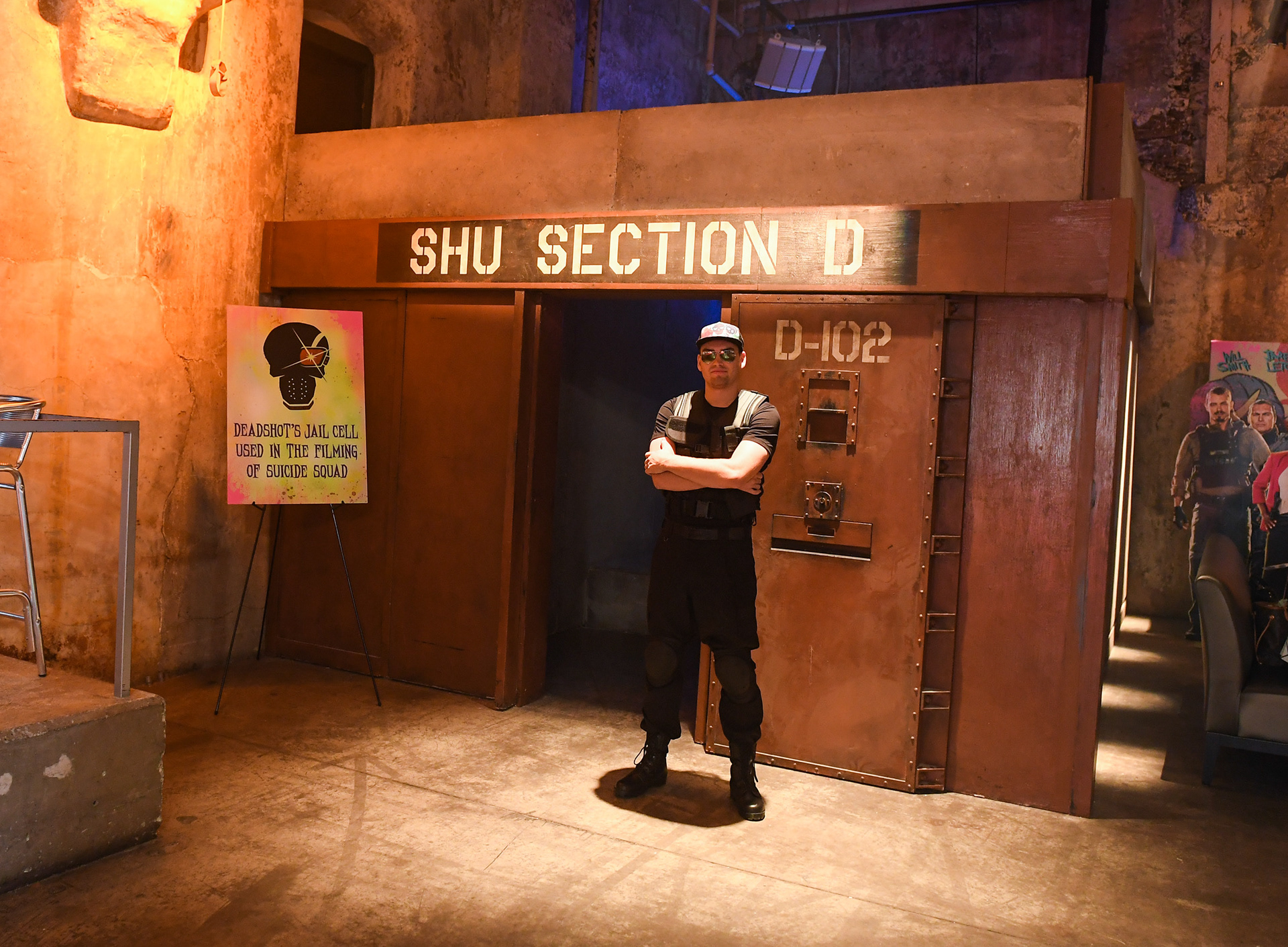 A guard stands outside Deadshot’s jail cell used in the filming of Suicide Squad.