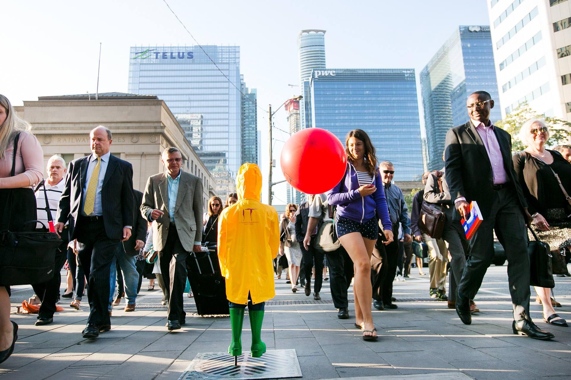 Commuters pass by the #WheresGeorgieTO activation in Toronto.