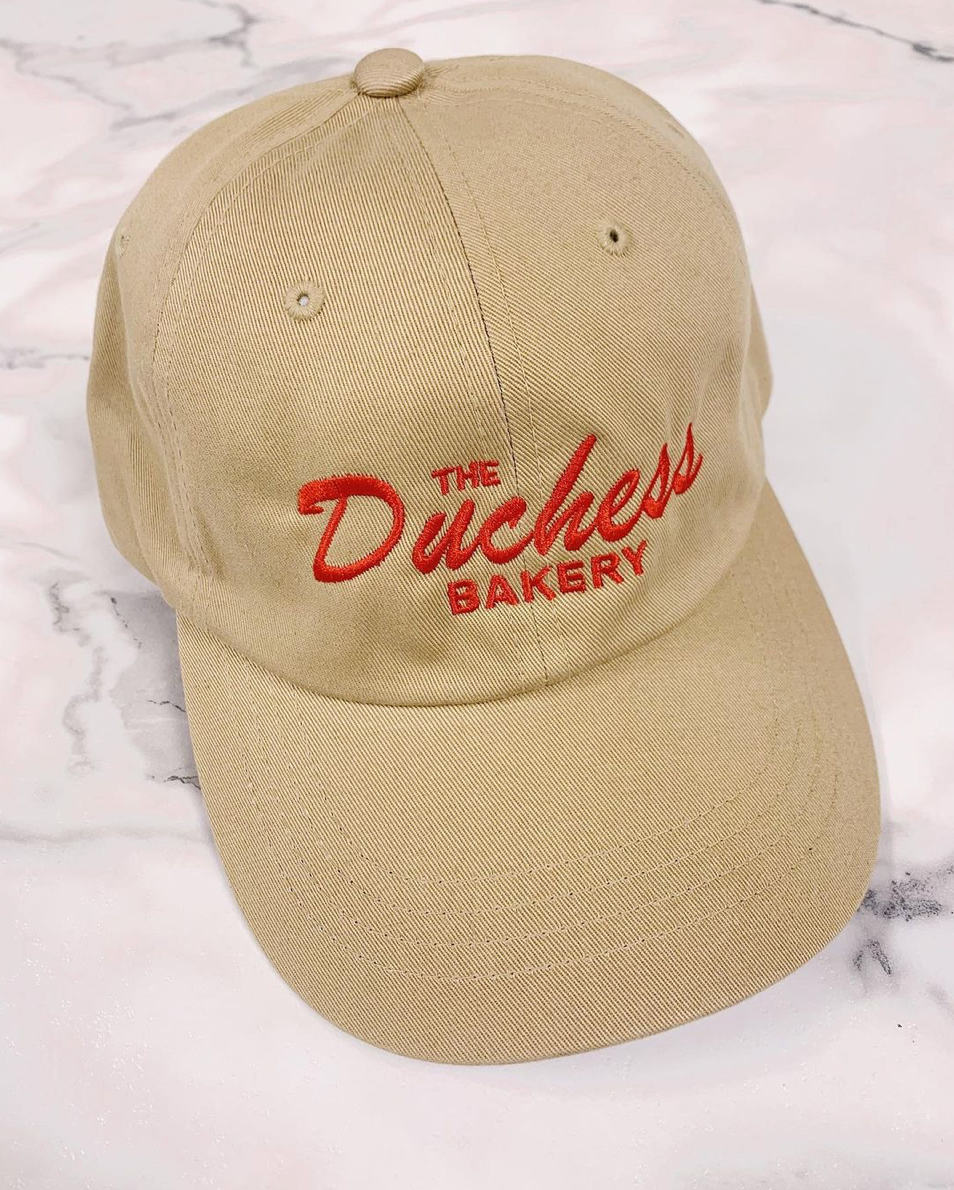 The Duchess Bakery Logo on Hat (via Instagram)
