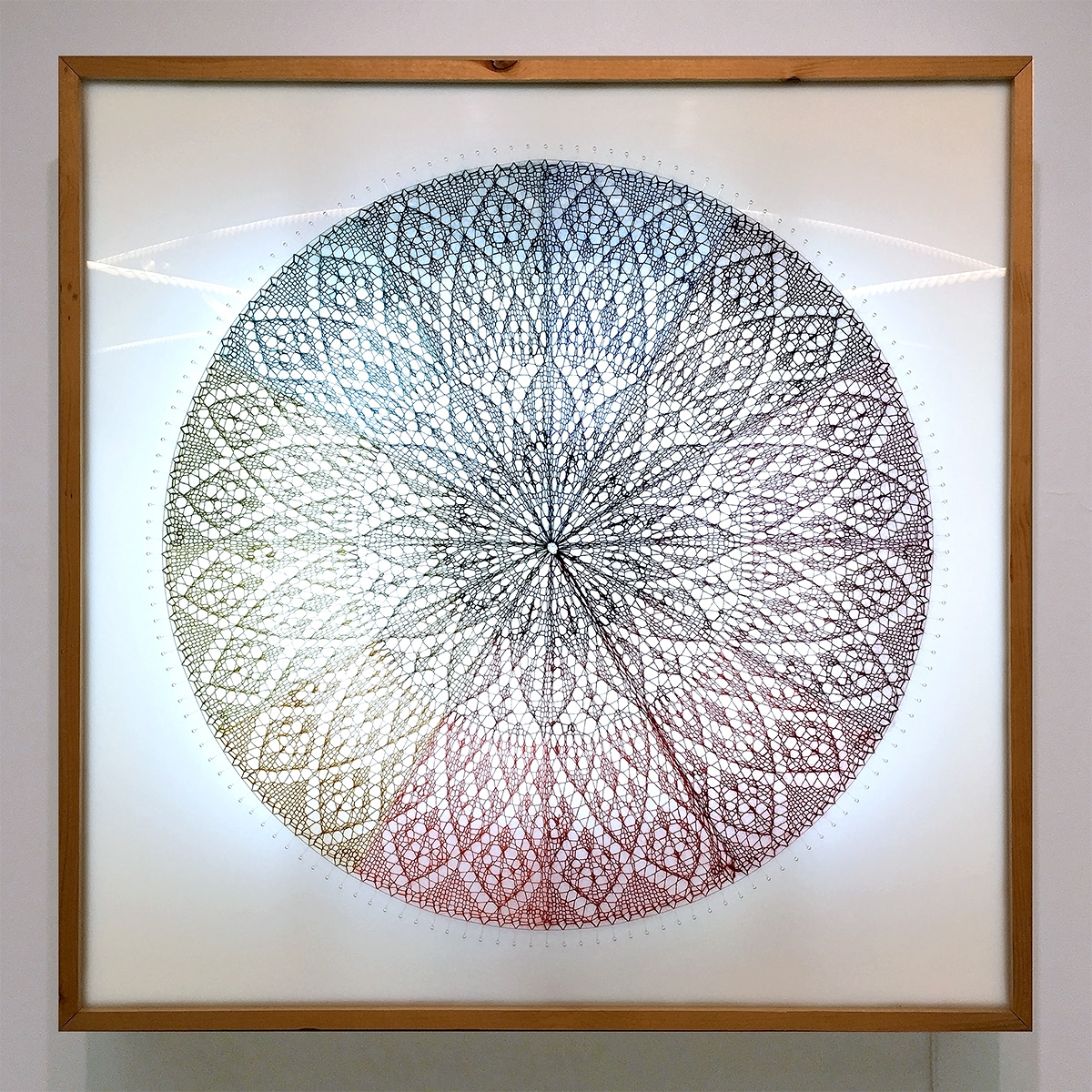 Farbenkugel #1, 2016, 36 x 36 x 6 inches, hand-knitted mohair stretched over lightbox