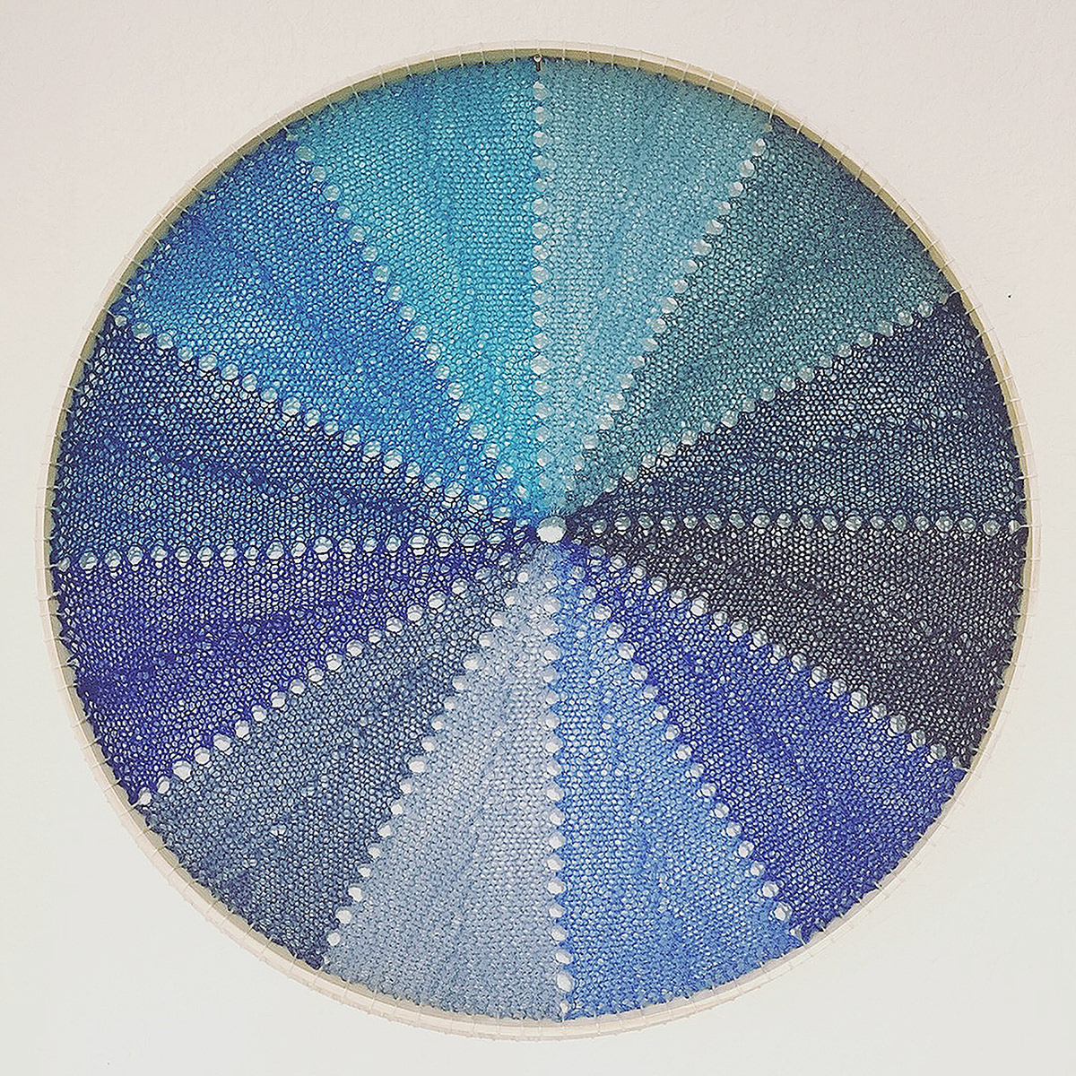 Blue Wheel, 2018, 18 inches diameter, hand-knitted wool