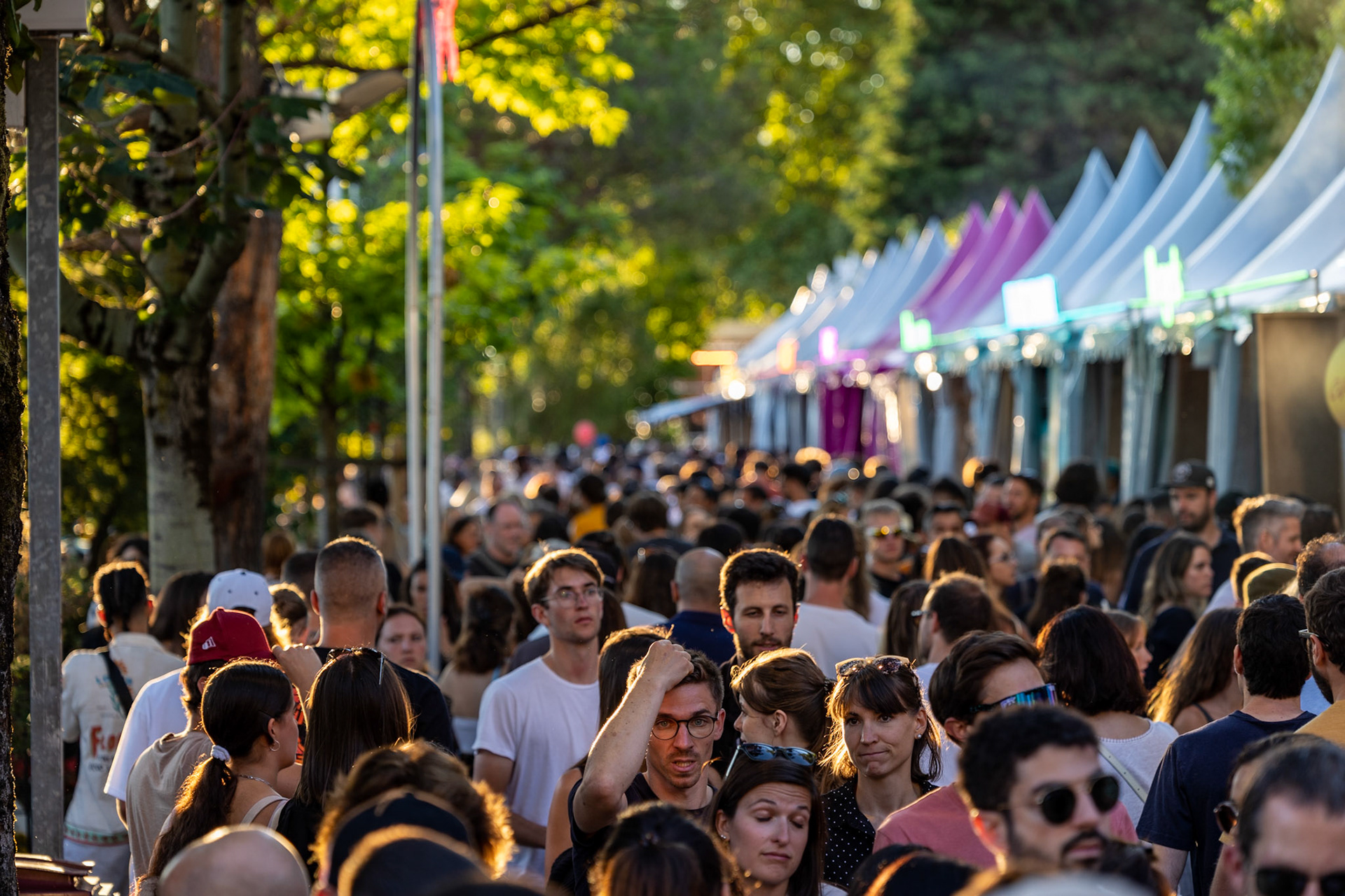 Crowds by the Lake Geneva at Montreux Jazz Festival. The food street is full of people.