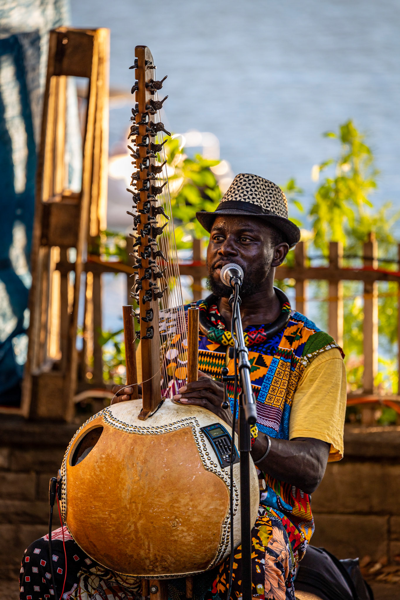 A performer playing kora by the street at Montreux Jazz Festival 2022