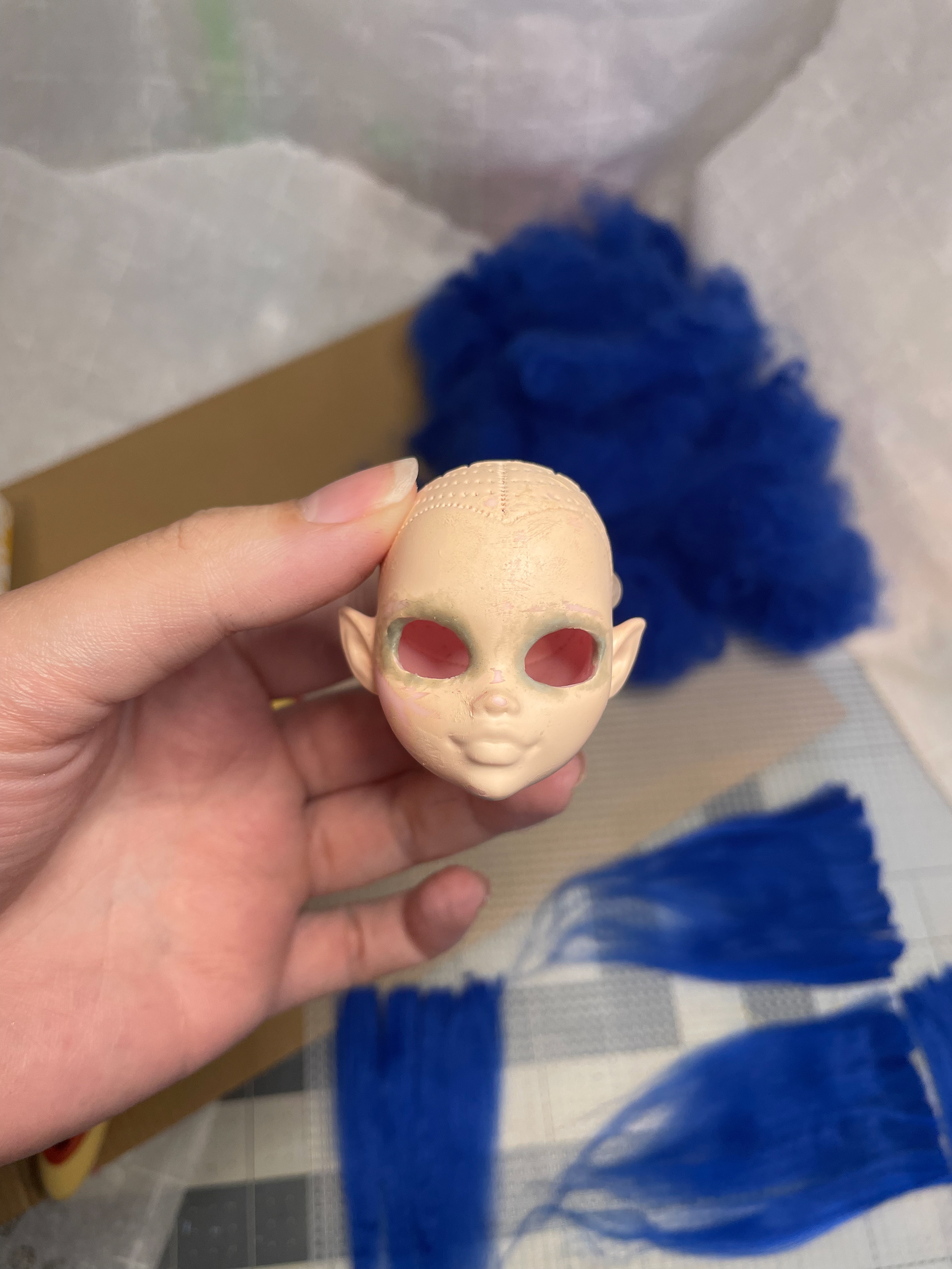 Cut out eyes and sculpted eyelids with apoxie sculpt