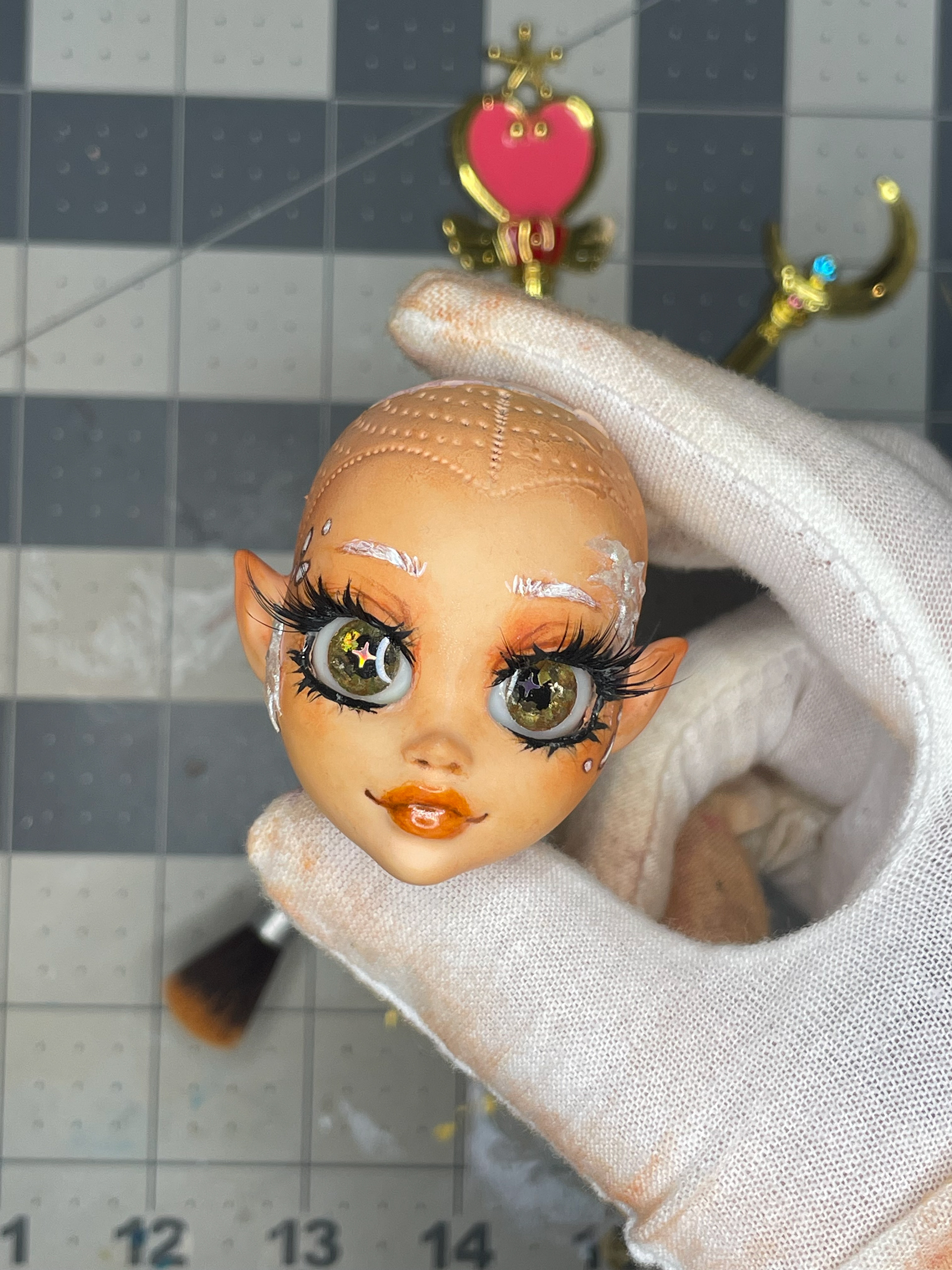 Completed face up with resin eyes