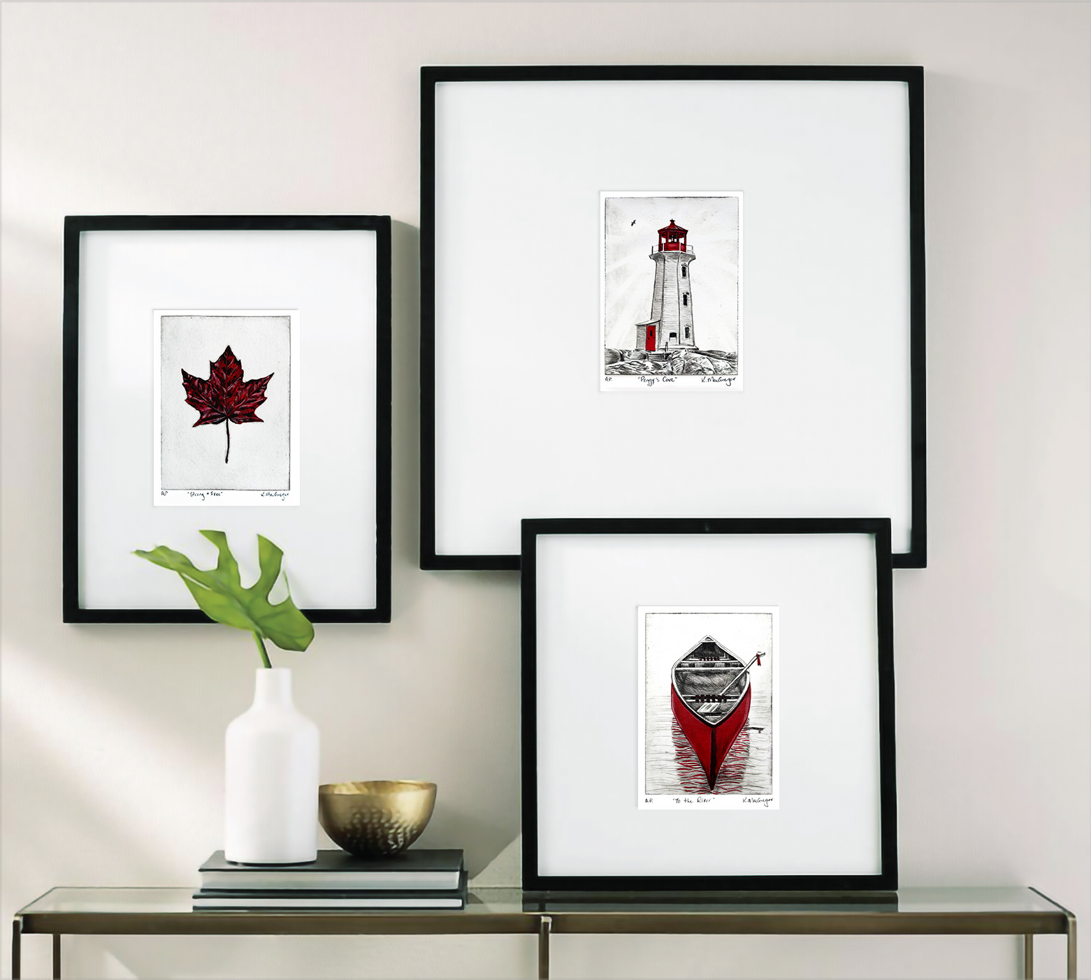Red Series of Drypoint print showing the Lighthouse (Peggy's Cove lighthouse) Red Maple Leaf, and Red Canoe framed. These are origninal Drypoint prints by Canadian artist Kristine MacGregor from Brant County Ontario