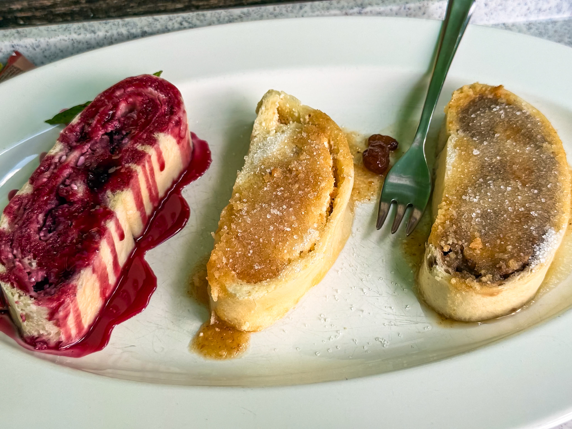 Štruckli, a rolled soft bread with cheese or fillings. Berry (left), cheese and sugar (middle), and cinnamon (right)