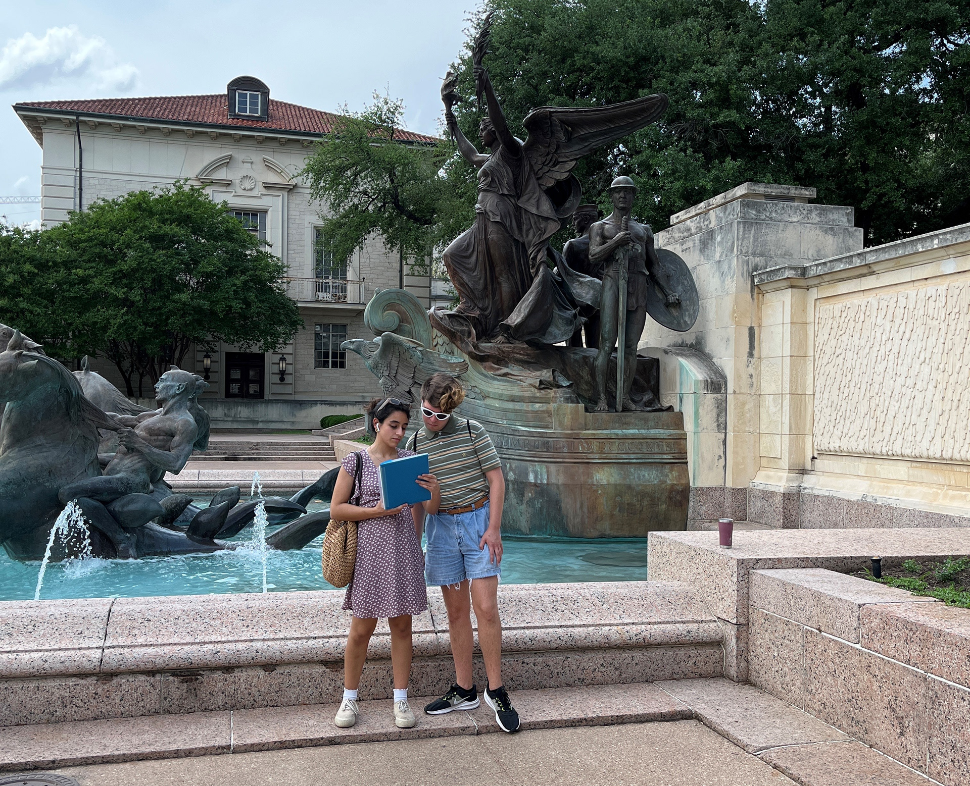 Maya and Matthew getting sidetracked in front of the fountain
