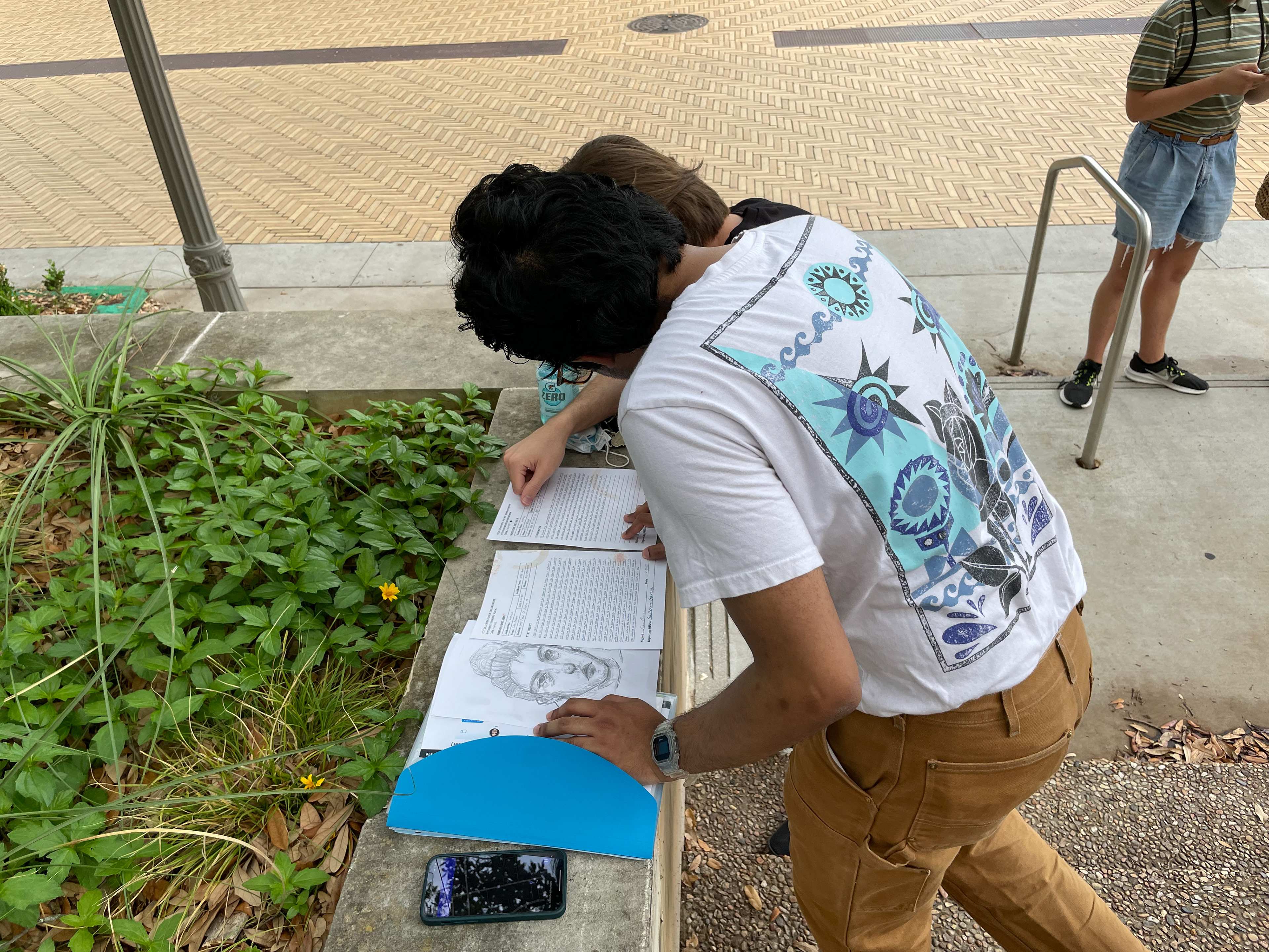 Brandon and Ammar stopping to check the files on the way to the Tower