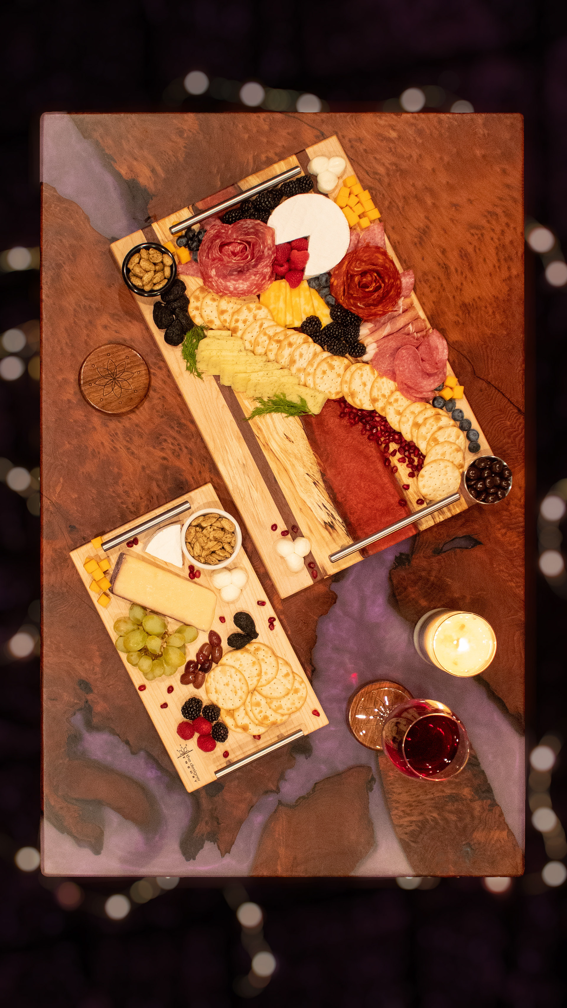 Laser Engraved and Resin River Charcuterie Boards, with coasters, on a Resin River Table