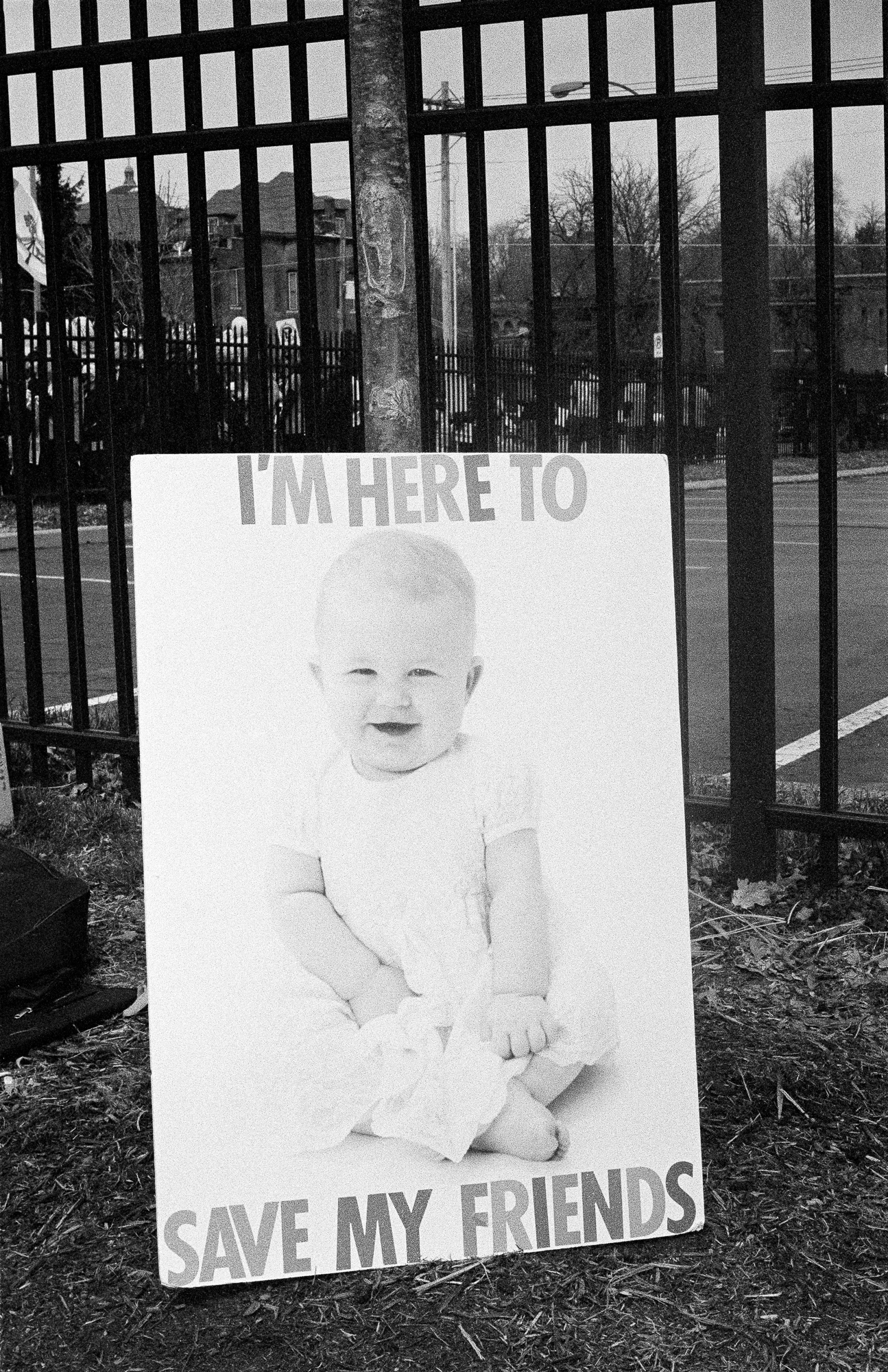 Poster with an image of a baby that reads "I'm here to save my friends"