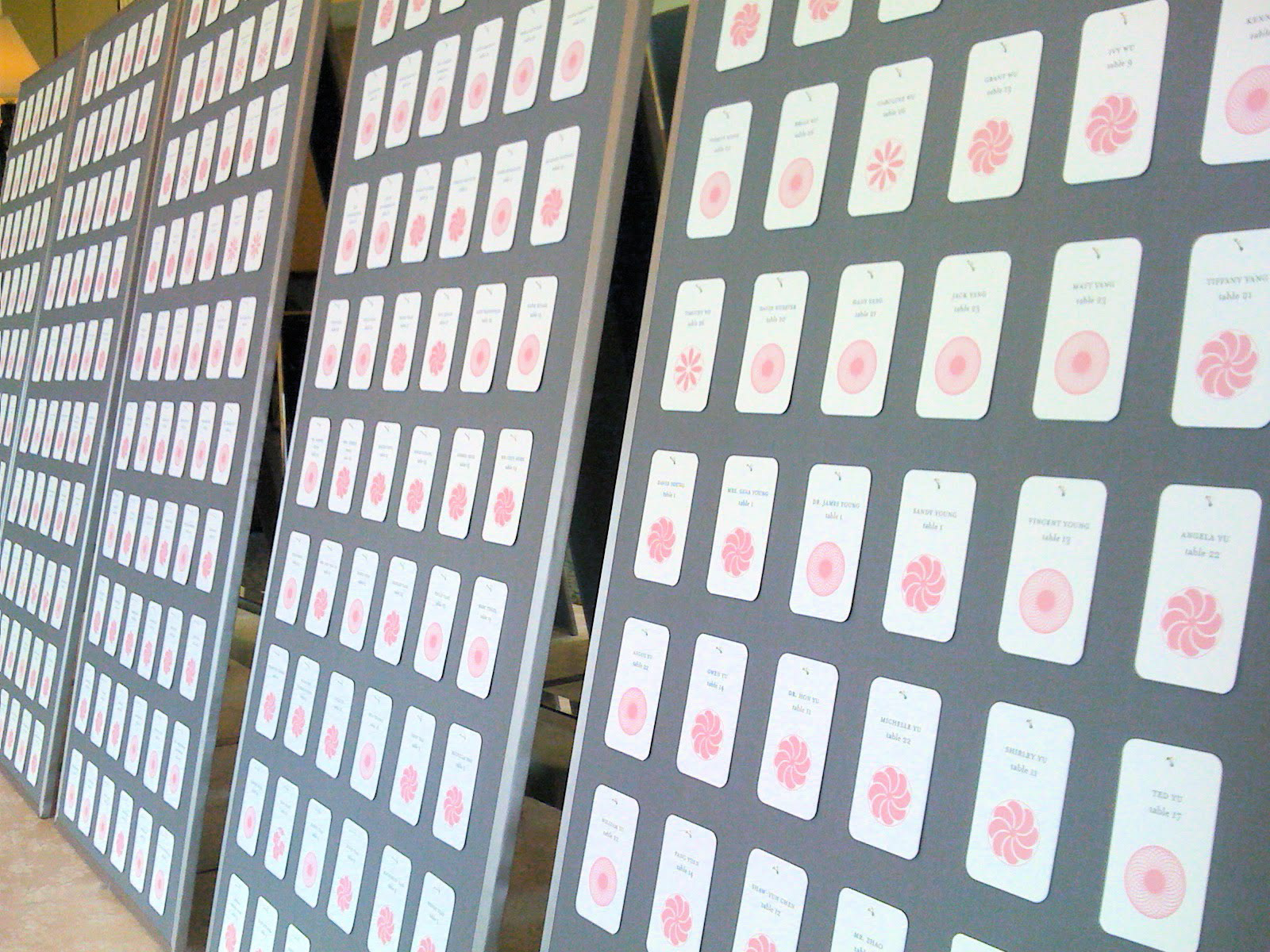 Seating cards pinned to fabric covered foam boards