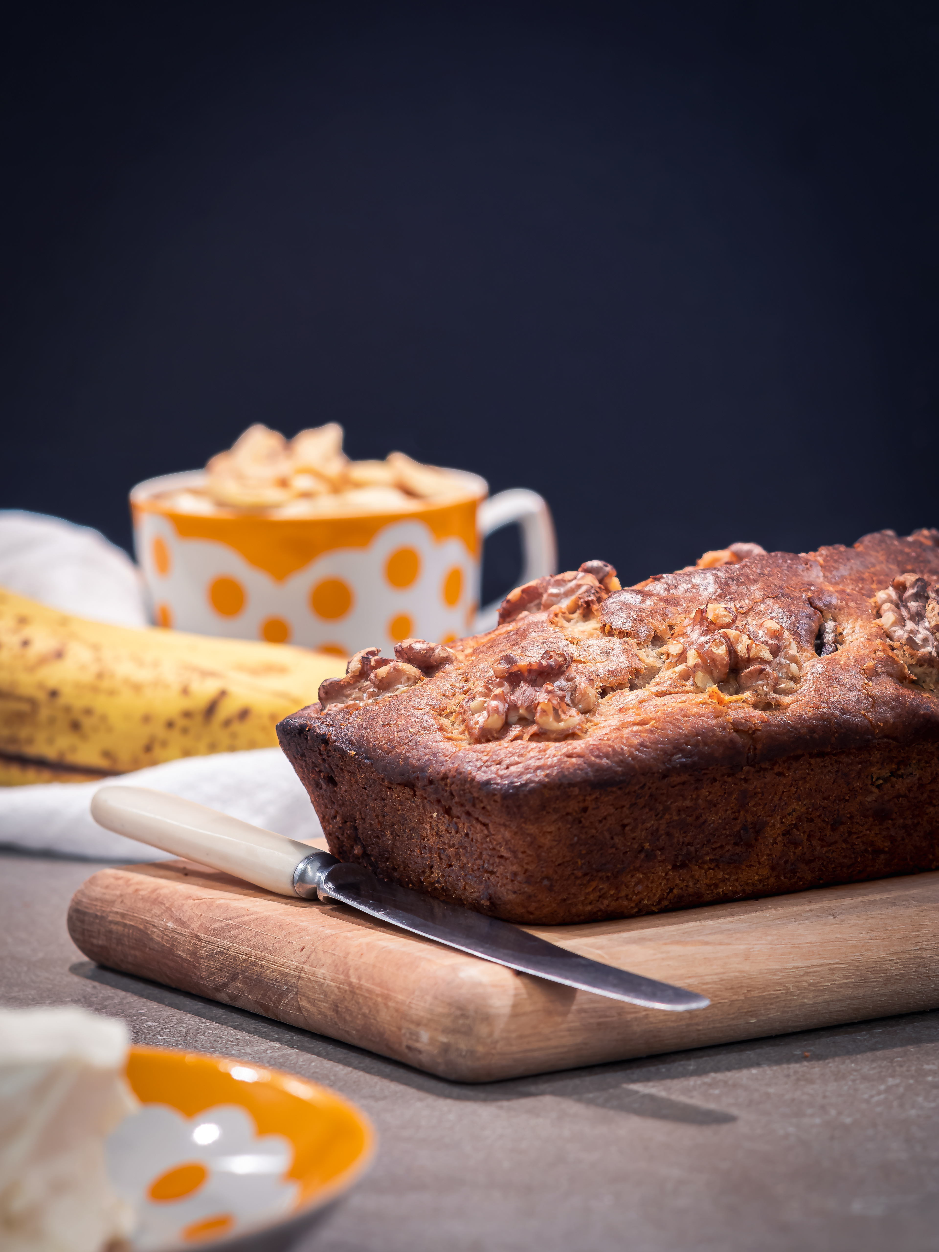 Banana bread on a dark and moody scene